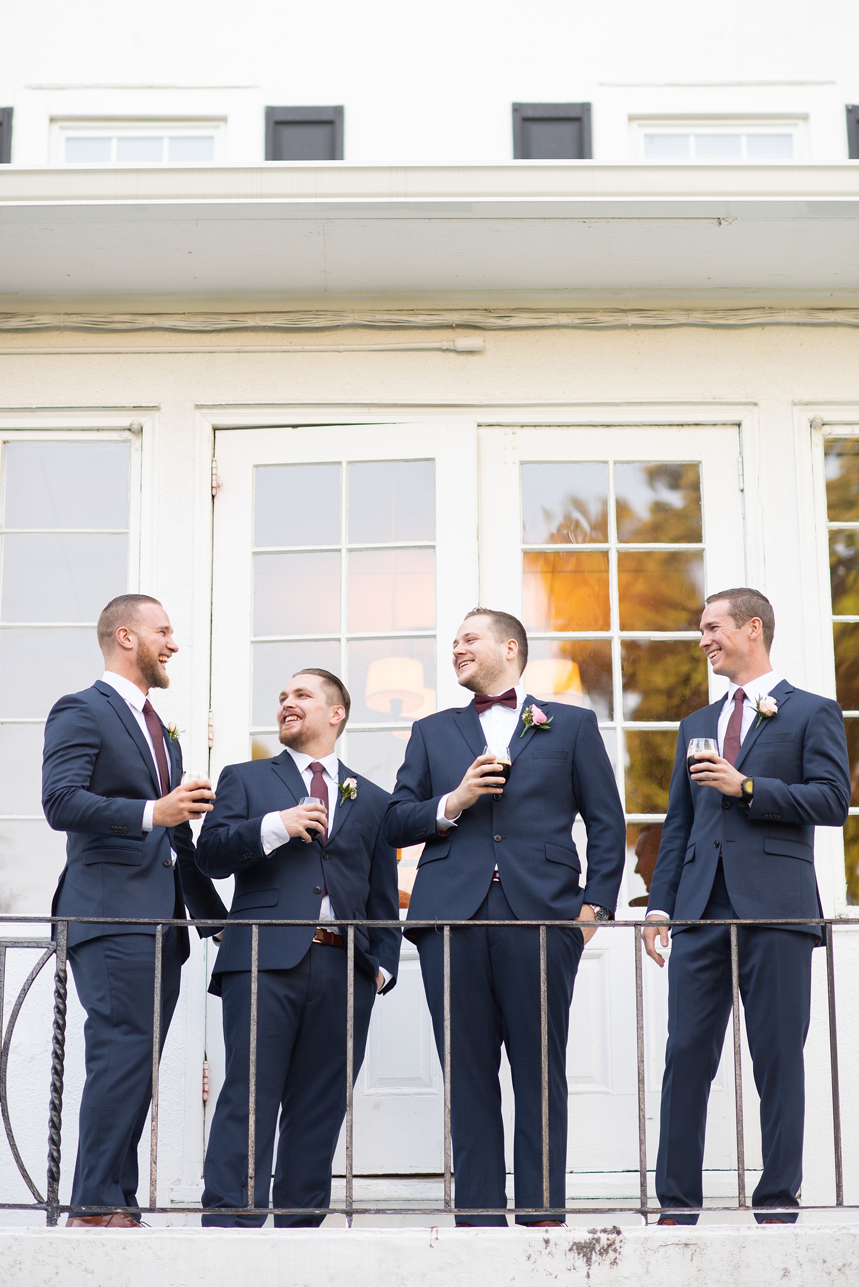 Wedding photos at Crabtree's Kittle House in Chappaqua, New York by Mikkel Paige Photography. This venue in Westchester county was the perfect place to capture their groomsmen photos in a country setting, with the groomsmen in custom navy blue suits with burgundy ties. The historic home is very close to NYC. Click through for more fall wedding inspiration from their day! #bluesuit #mikkelpaige #CrabtreesKittleHouse #WestchesterWeddingVenues #WestchesterWedding #SeptemberWedding #weddingparty #groomsmen #navysuits #customsuits #groom