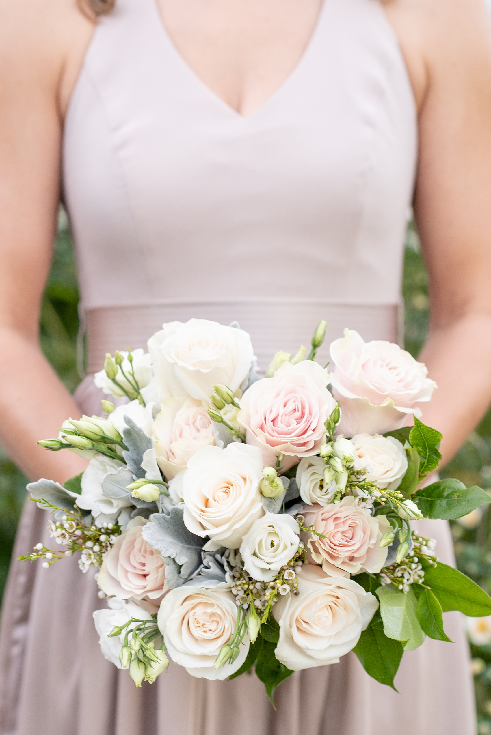 Wedding photos at Crabtree's Kittle House in Chappaqua, New York by Mikkel Paige Photography. This venue in Westchester county was the perfect place to capture their groomsmen photos in a country setting, with the bridesmaids in mis-matched dusty rose silk gowns carrying pink, white and peach rose and eucalyptus bouquets with Dusty Miller. The historic home is very close to NYC and perfect for a fall celebration. Click through for more wedding inspiration from their day! #bridesmaids #mikkelpaige #CrabtreesKittleHouse #WestchesterWeddingVenues #WestchesterWedding #SeptemberWedding #weddingparty #bride #dustryrose #fallwedding