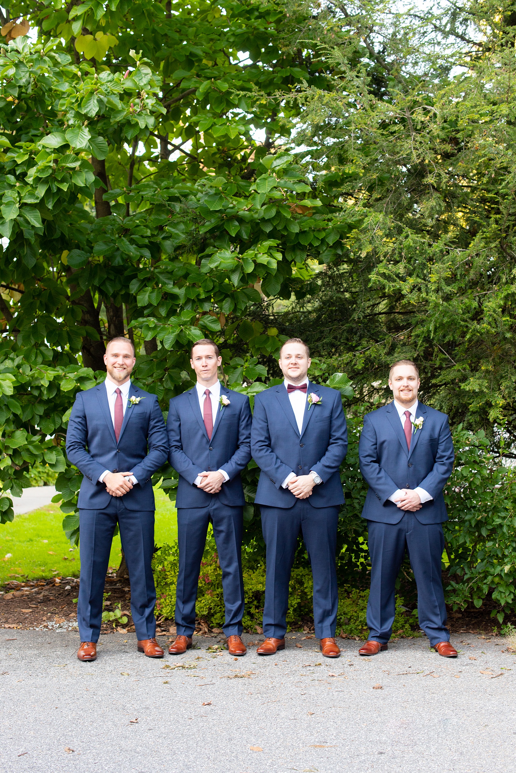 Wedding photos at Crabtree's Kittle House in Chappaqua, New York by Mikkel Paige Photography. This venue in Westchester county was the perfect place to capture their groomsmen photos in a country setting, with the groomsmen in custom navy blue suits with burgundy ties. The historic home is very close to NYC. Click through for more fall wedding inspiration from their day! #bluesuit #mikkelpaige #CrabtreesKittleHouse #WestchesterWeddingVenues #WestchesterWedding #SeptemberWedding #weddingparty #groomsmen #navysuits #customsuits #groom