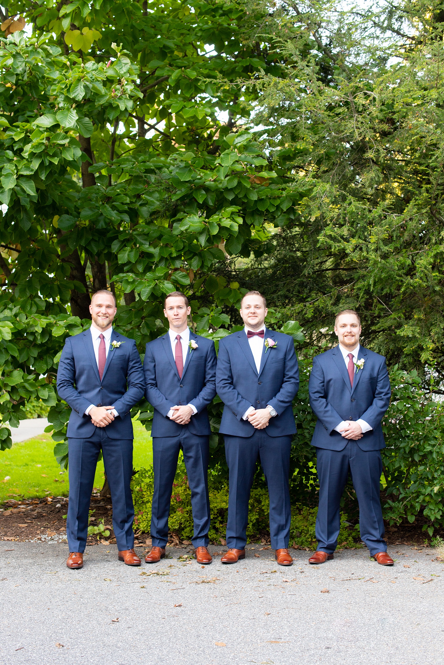 Wedding photos at Crabtree's Kittle House in Chappaqua, New York by Mikkel Paige Photography. This venue in Westchester county was the perfect place to capture their groomsmen photos in a country setting, with the groomsmen in custom navy blue suits with burgundy ties. The historic home is very close to NYC. Click through for more fall wedding inspiration from their day! #bluesuit #mikkelpaige #CrabtreesKittleHouse #WestchesterWeddingVenues #WestchesterWedding #SeptemberWedding #weddingparty #groomsmen #navysuits #customsuits #groom