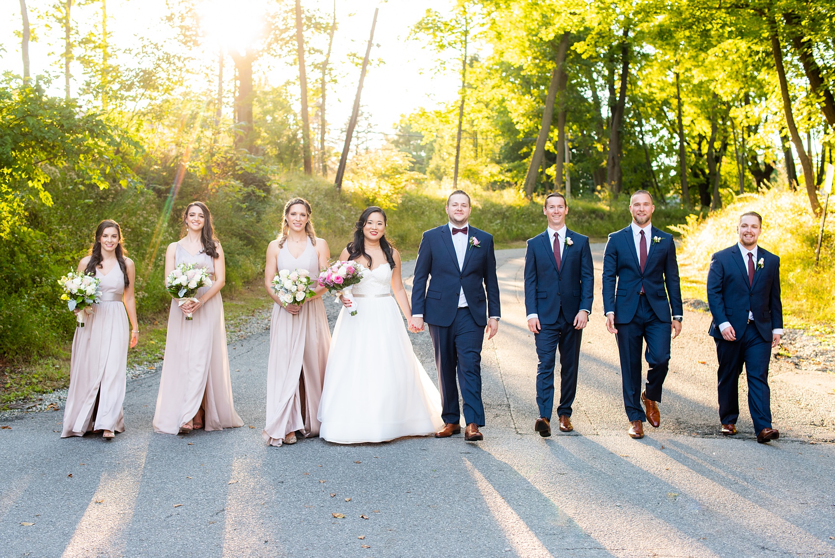 Wedding photos at Crabtree's Kittle House in Chappaqua, New York by Mikkel Paige Photography. This venue in Westchester county was the perfect place to capture their creative pictures, with the bridesmaids in dusty rose gowns & men in custom blue suits. The historic home is very close to NYC & has a country-like setting. Click through for more inspiration from their fall day! #bluesuit #mikkelpaige #CrabtreesKittleHouse #WestchesterWeddingVenues #weddingparty #bridalparty #vogueweddingphotos