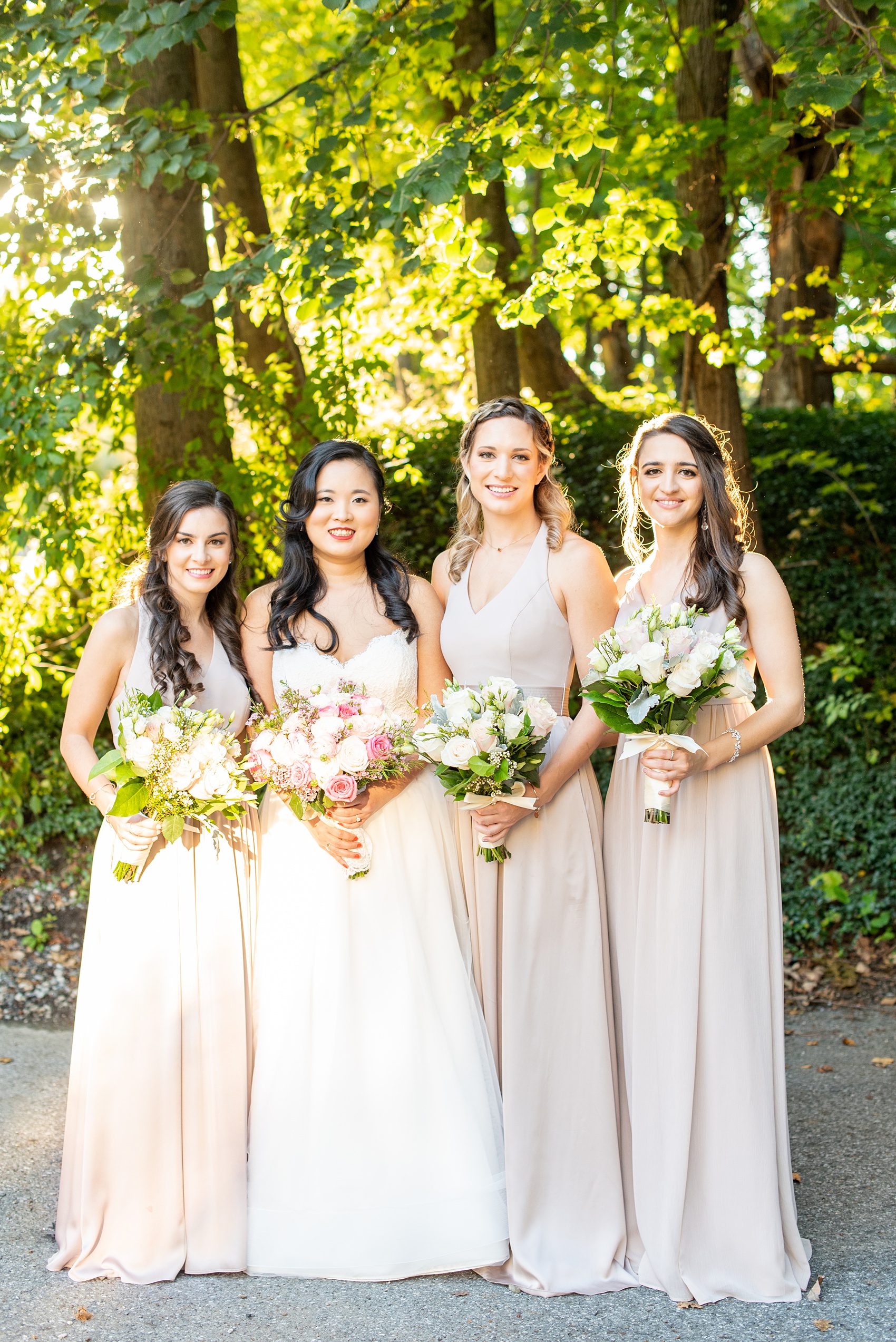 Wedding photos at Crabtree's Kittle House in Chappaqua, New York by Mikkel Paige Photography. This venue in Westchester county was the perfect place to capture their groomsmen photos in a country setting, with the bridesmaids in mis-matched dusty rose silk gowns carrying pink, white and peach rose and eucalyptus bouquets with Dusty Miller. The historic home is very close to NYC and perfect for a fall celebration. Click through for more wedding inspiration from their day! #bridesmaids #mikkelpaige #CrabtreesKittleHouse #WestchesterWeddingVenues #WestchesterWedding #SeptemberWedding #weddingparty #bride #dustryrose #fallwedding