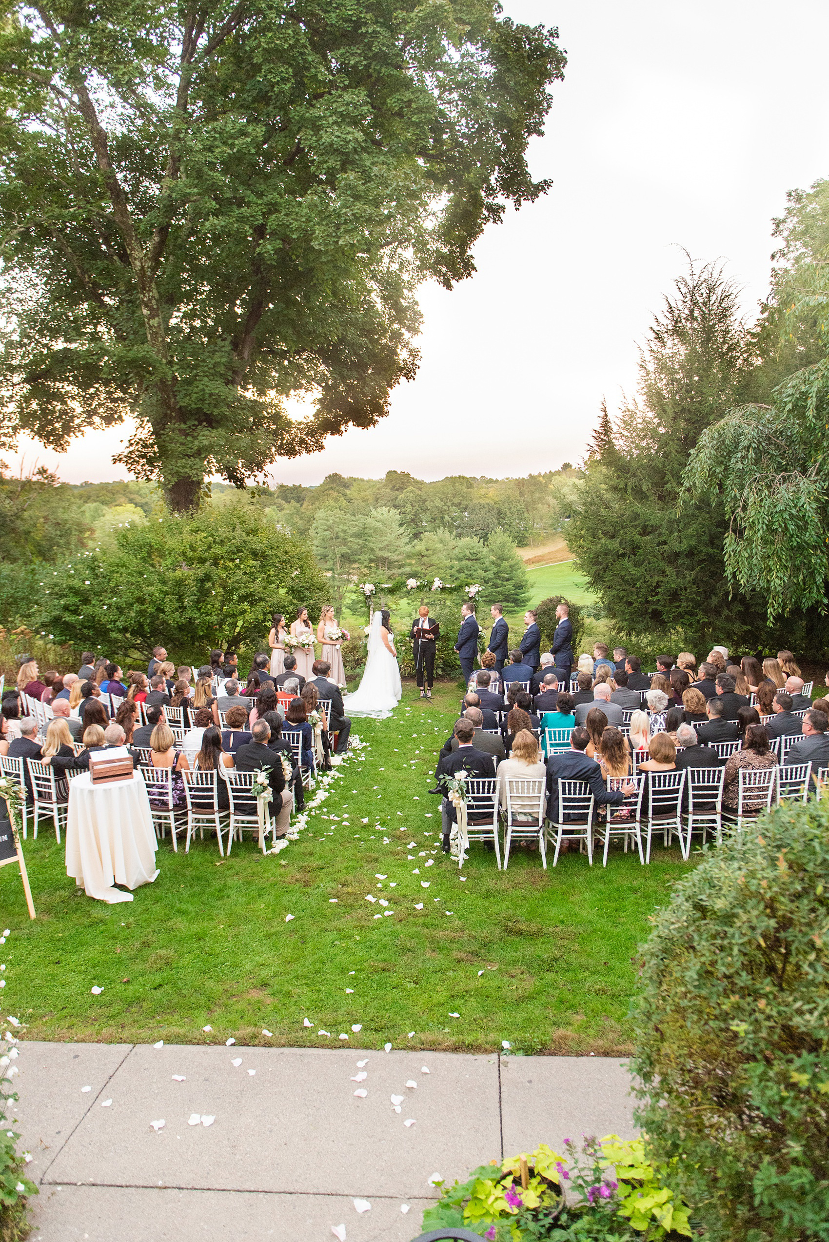 Wedding photos at Crabtree's Kittle House in Chappaqua, New York by Mikkel Paige Photography. This venue in Westchester county is a beautiful location for an outdoor September wedding. The couple’s ceremony overlooked an awesome fall landscape and custom chalkboard sign welcomed guests. Click through for more inspiration from their day! #mikkelpaige #CrabtreesKittleHouse #WestchesterWeddingVenues #WestchesterWedding #SeptemberWedding #weddingceremony #outdoorceremony #marriagevows