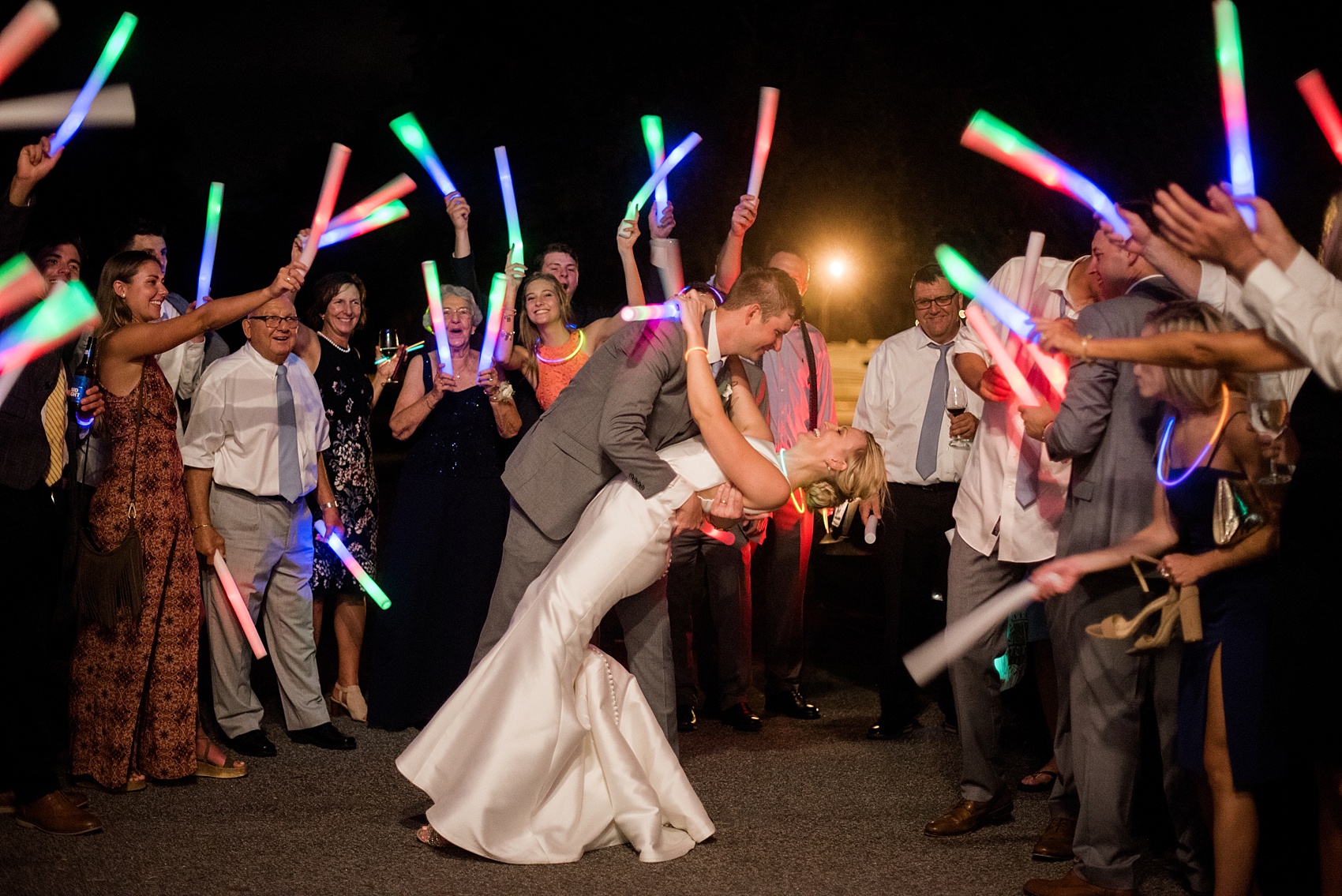 Pictures by Mikkel Paige Photography of a wedding in Durham, North Carolina. The beautiful white hydrangea flowers from the day’s events adorned a reception with cocktail hour overlooking a pretty garden-like golf course. The DJ played tunes everyone danced the night away to before a glowstick exit. Click through to our website for the complete post and details! #durhamNC #northcarolinawedding #golfcoursewedding #CountryClubWedding #DurhamWedding #summerwedding #weddingexit #glowstickexit 