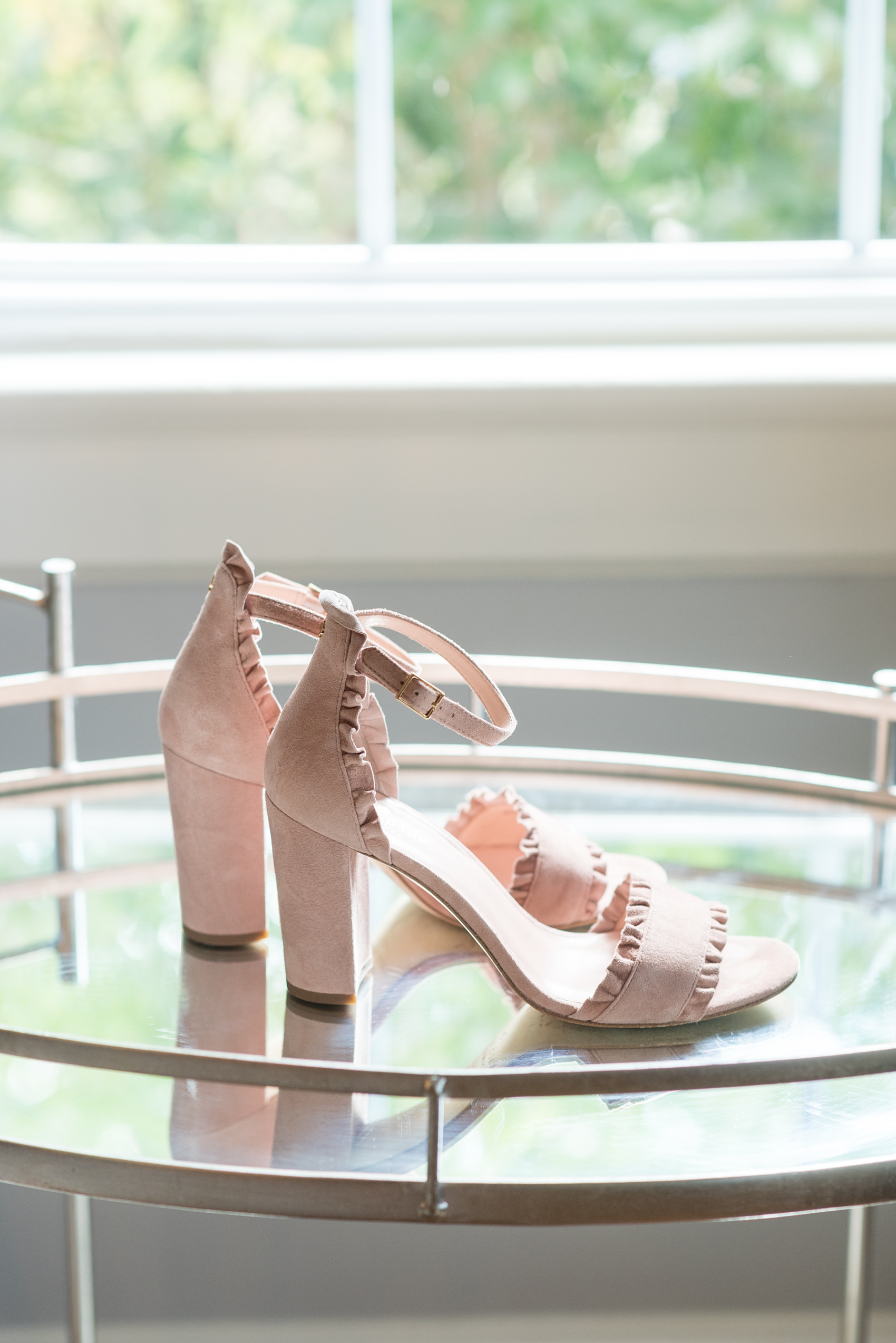 Highgrove Estate wedding photos in North Carolina by Mikkel Paige Photography. These pictures show a beautiful venue and detail images in the bridal suite near Raleigh. The bride had a lace gown + chunky suede Kate Spade shoes to match her pink and green wedding, planned by @asouthernsoiree. Click through for more details like this from their celebration! #NorthCarolinaVenues #WeddingVenues #MikkelPaige #ASouthernSoiree #weddingdetails #weddingshoes #pinkweddingdetails