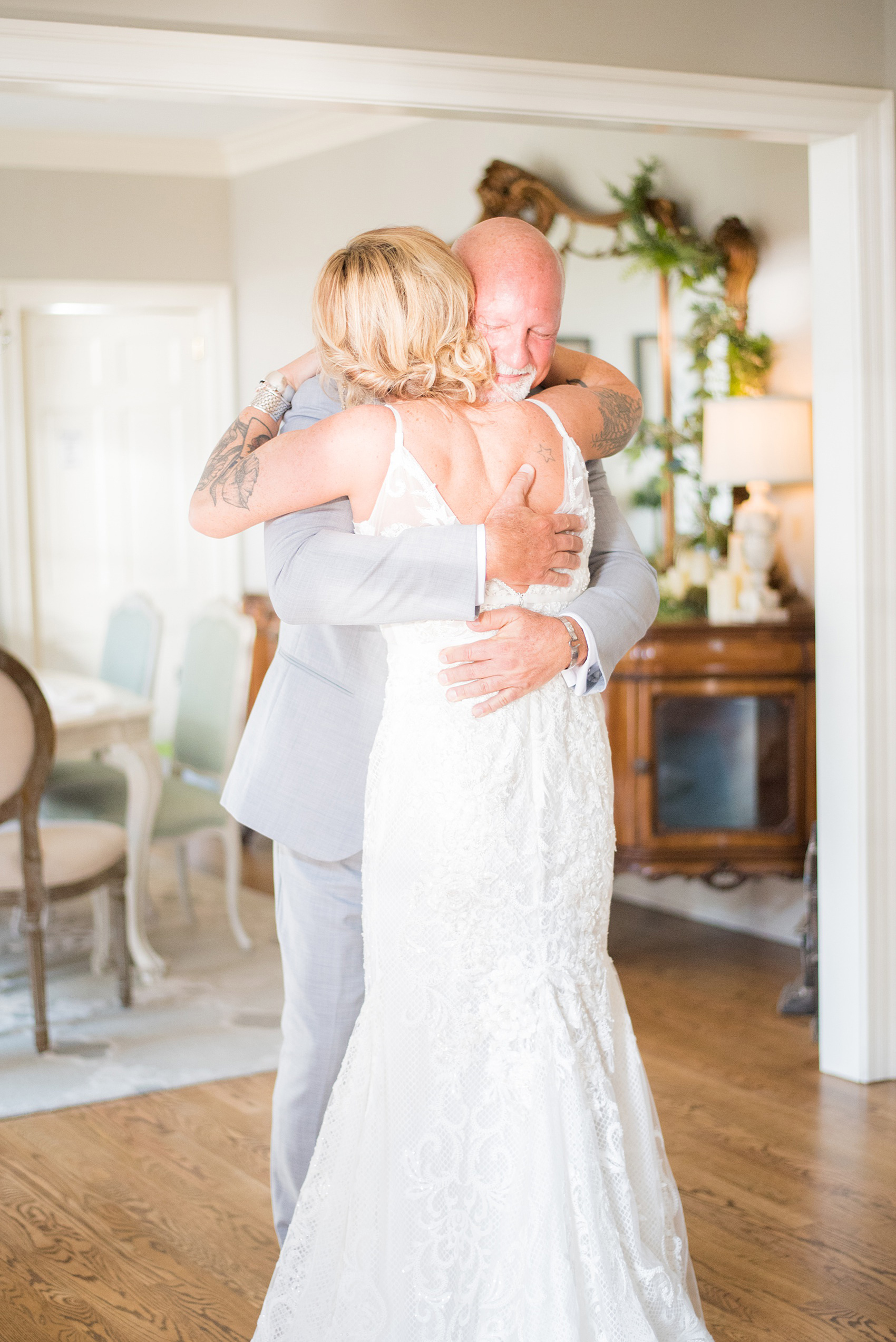 Highgrove Estate wedding photos in North Carolina by Mikkel Paige Photography. The bride and groom wanted rustic, urban pictures in downtown Fuquay-Varina near Raleigh, after their first look inside the beautiful home. They had a pink + green palette, planned by @asouthernsoiree, with tropical flowers and balloons for their tented dinner. Click through for all the details for their awesome party! #NorthCarolinaVenues #WeddingVenues #MikkelPaige #ASouthernSoiree #firstlook #brideandgroom