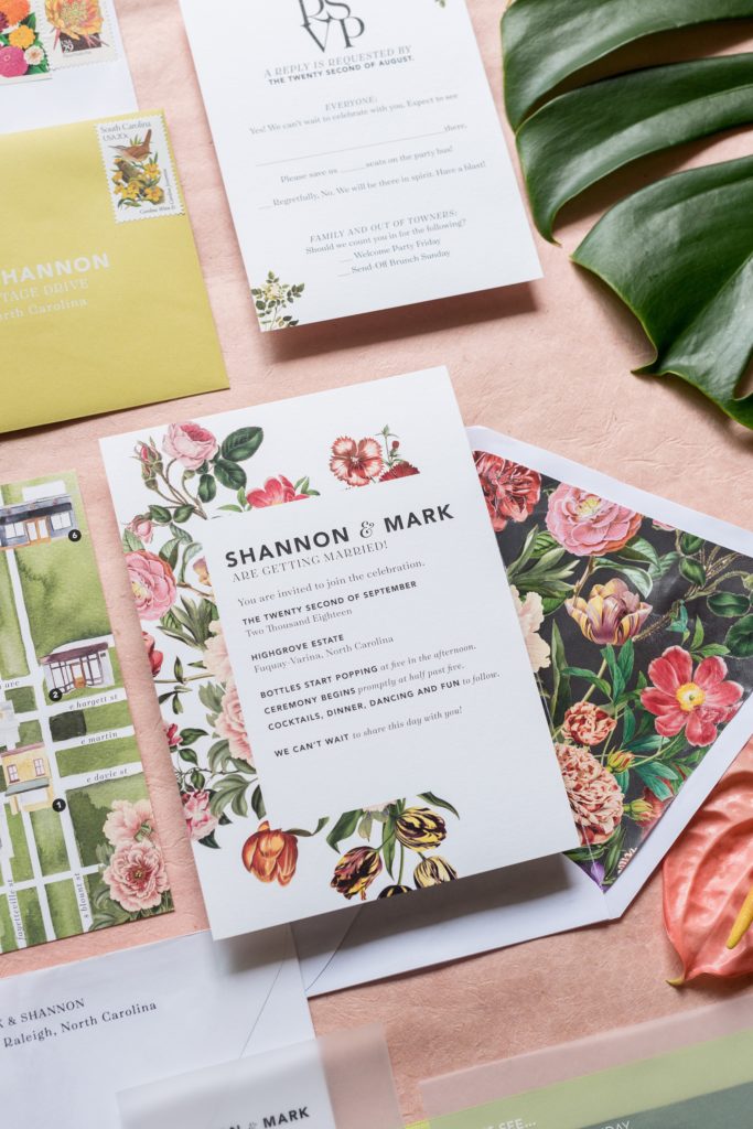 Highgrove Estate wedding photos by Mikkel Paige Photography. This beautiful venue works for a wedding large or small, near Raleigh, North Carolina. The couple had fun custom signs, stationery + table numbers that said places the couple travel to by @oneandonlypaper as well as an awesome escort card wall with keychains + custom place cards, planned by @asouthernsoiree. Click through to see the pink and green ideas in their tented reception space! #MikkelPaige #ASouthernSoiree #oopaper