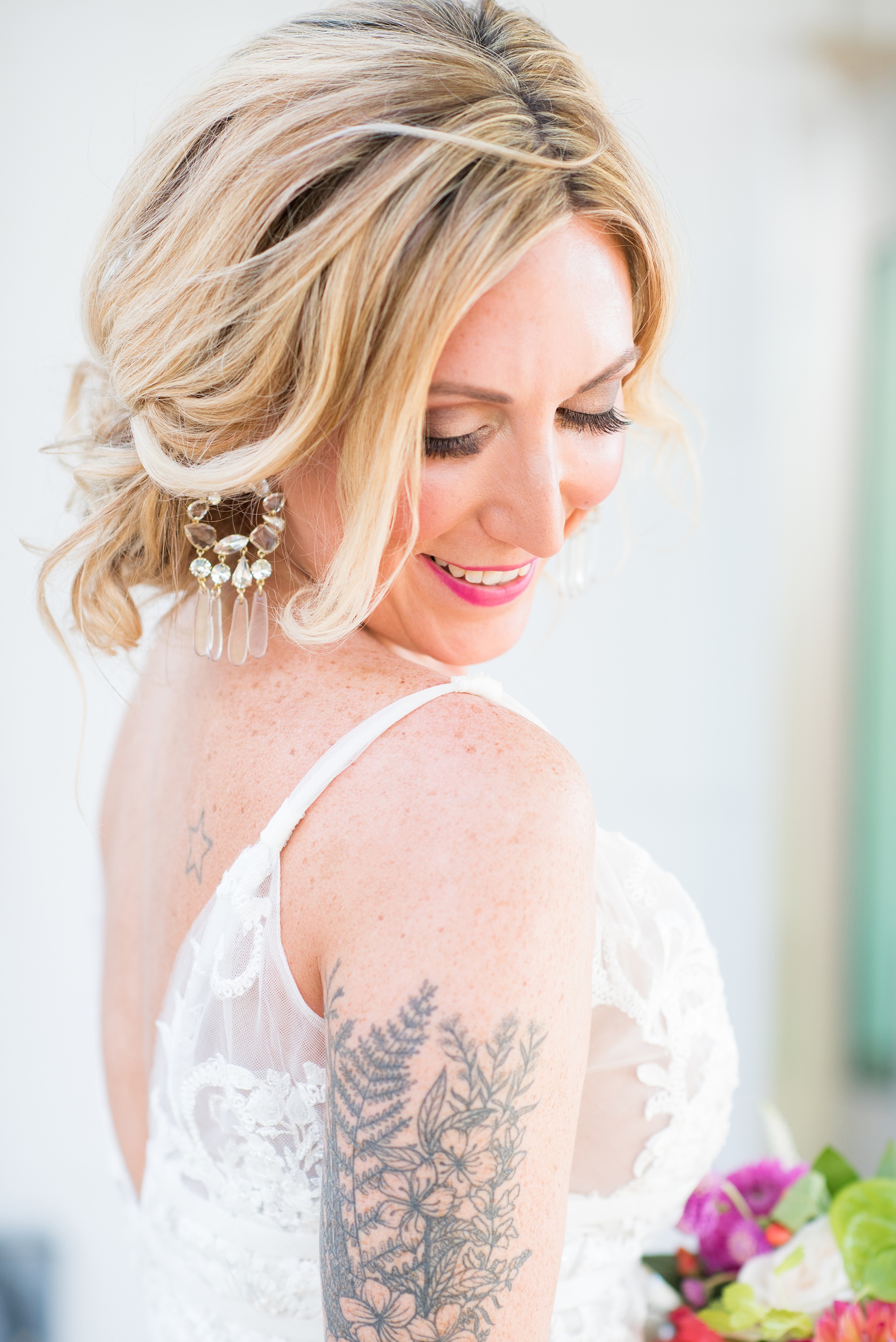 Highgrove Estate wedding photos in North Carolina by Mikkel Paige Photography. This tattooed bride wore a lace gown and her style beautiful personality matched her awesome reception details. They had a pink + green palette, planned by @asouthernsoiree, with tropical flowers + floral patterns on custom stationery. Click through for beautiful ideas for their outdoor party! #NorthCarolinaVenues #WeddingVenues #MikkelPaige #ASouthernSoiree #tropicalflowers #bridestyle #tattooedbride #bride