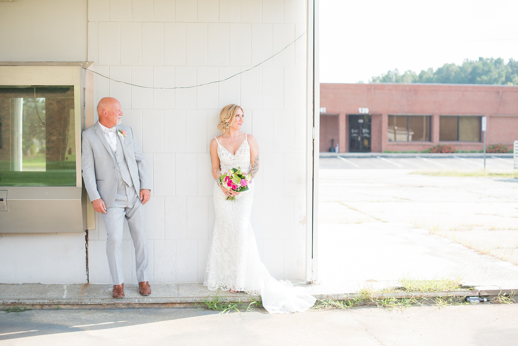 Highgrove Estate wedding photos in North Carolina by Mikkel Paige Photography. This tattooed bride + her groom wanted rustic, urban pictures in downtown Fuquay-Varina, near Raleigh. They had a pink + green palette, planned by @asouthernsoiree, with tropical flowers and balloons for their tented dinner. Click through for all the details for their awesome party! #NorthCarolinaVenues #WeddingVenues #MikkelPaige #ASouthernSoiree #tropicalflowers #brideandgroom #tattooedbride #weddingdetails