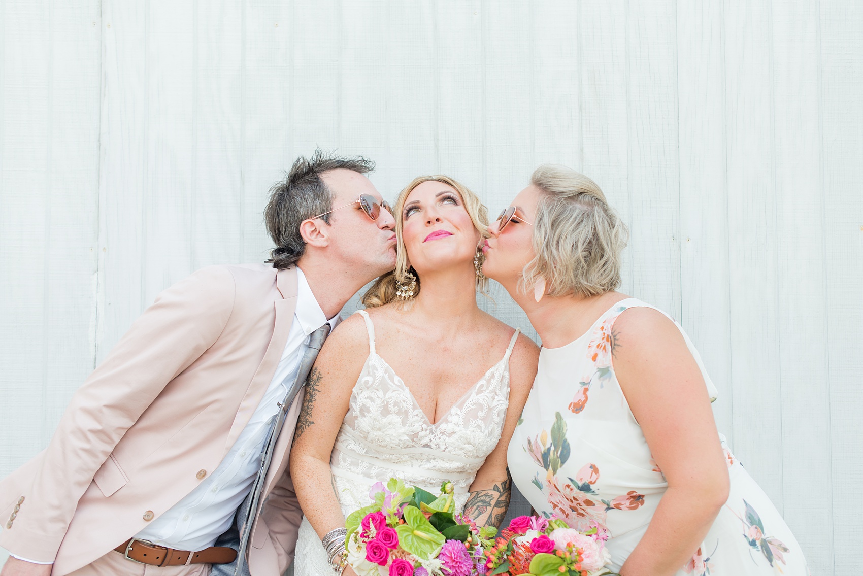 Highgrove Estate wedding photos in North Carolina by Mikkel Paige Photography. The bride + groom wanted urban, rustic pictures outdoors in downtown Fuquay-Varina with their wedding party, near Raleigh. They had a pink + green palette, planned by @asouthernsoiree, with tropical flowers for their tented dinner. The groomsmen wore grey + pink, and maid of honor a floral pattern dress. Click for pictures from their awesome party! #NorthCarolinaVenues #MikkelPaige #ASouthernSoiree #weddingparty