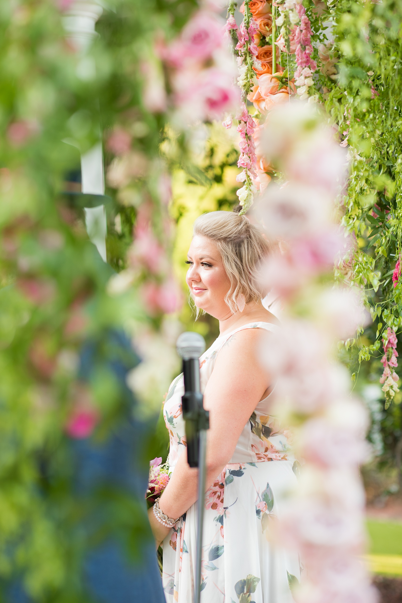 Highgrove Estate wedding photos by Mikkel Paige Photography. It’s a beautiful venue for a wedding large or small, near Raleigh, North Carolina. This wedding had fun signs, custom stationery and table numbers that said places the bride & groom travel to, and romantic candlelight planned by @asouthernsoiree. Click through to see the tropical green leaves, pink and orange flowers dripping from their outdoor ceremony space! #NorthCarolinaVenues #MikkelPaige #ASouthernSoiree #OutdoorCeremony