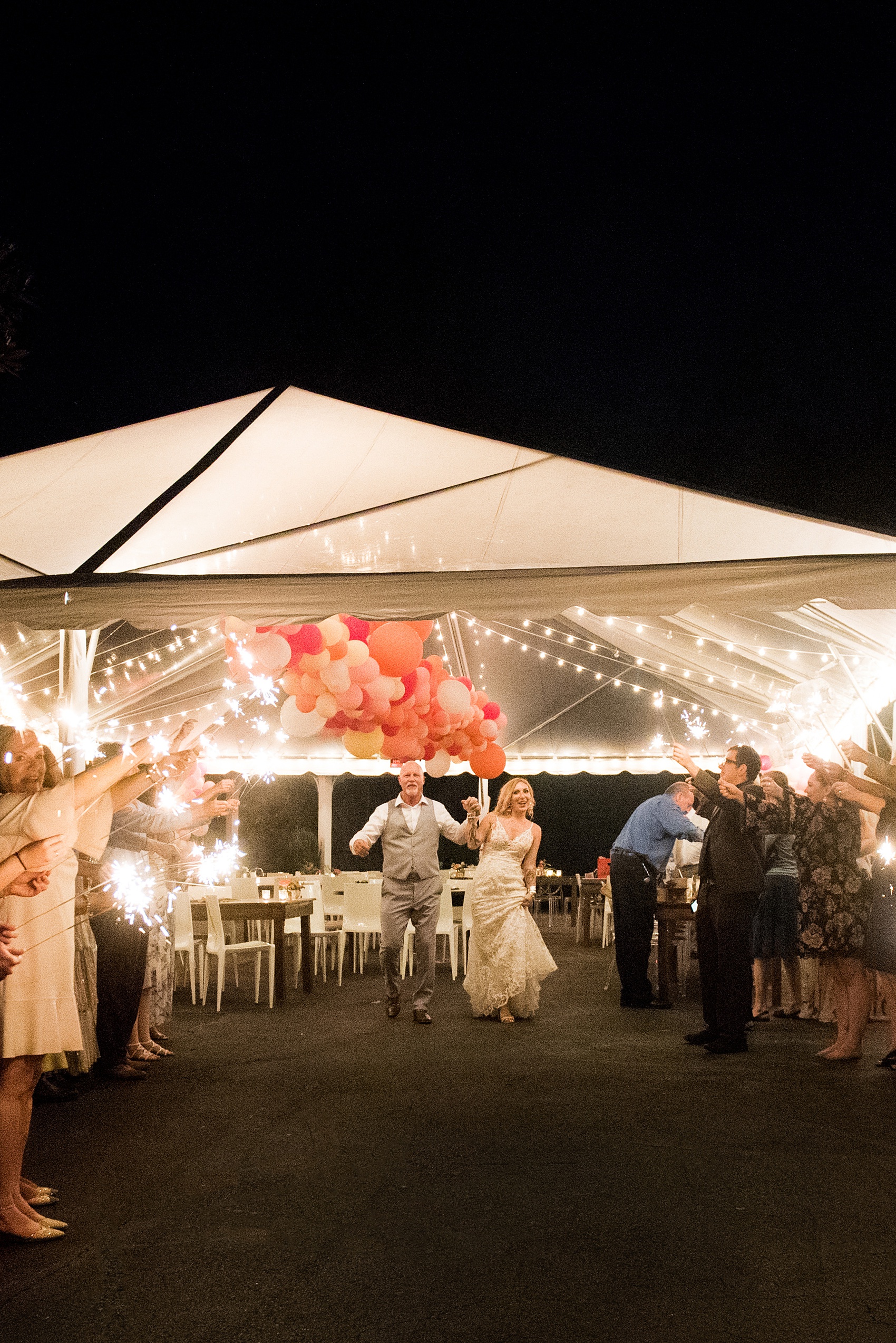 Highgrove Estate wedding photos by Mikkel Paige Photography. This beautiful venue works for a wedding large or small, near Raleigh, North Carolina. The couple had a fun ZimZoom Photobooth, beautiful desserts + romantic candlelight in a lounge space planned by @asouthernsoiree. Guests danced to the tunes from a record playing DJ. Click through to see more awesome ideas from their flower and balloon-filled reception space! #MikkelPaige #ASouthernSoiree #HighgroveEstate #sparklerexit