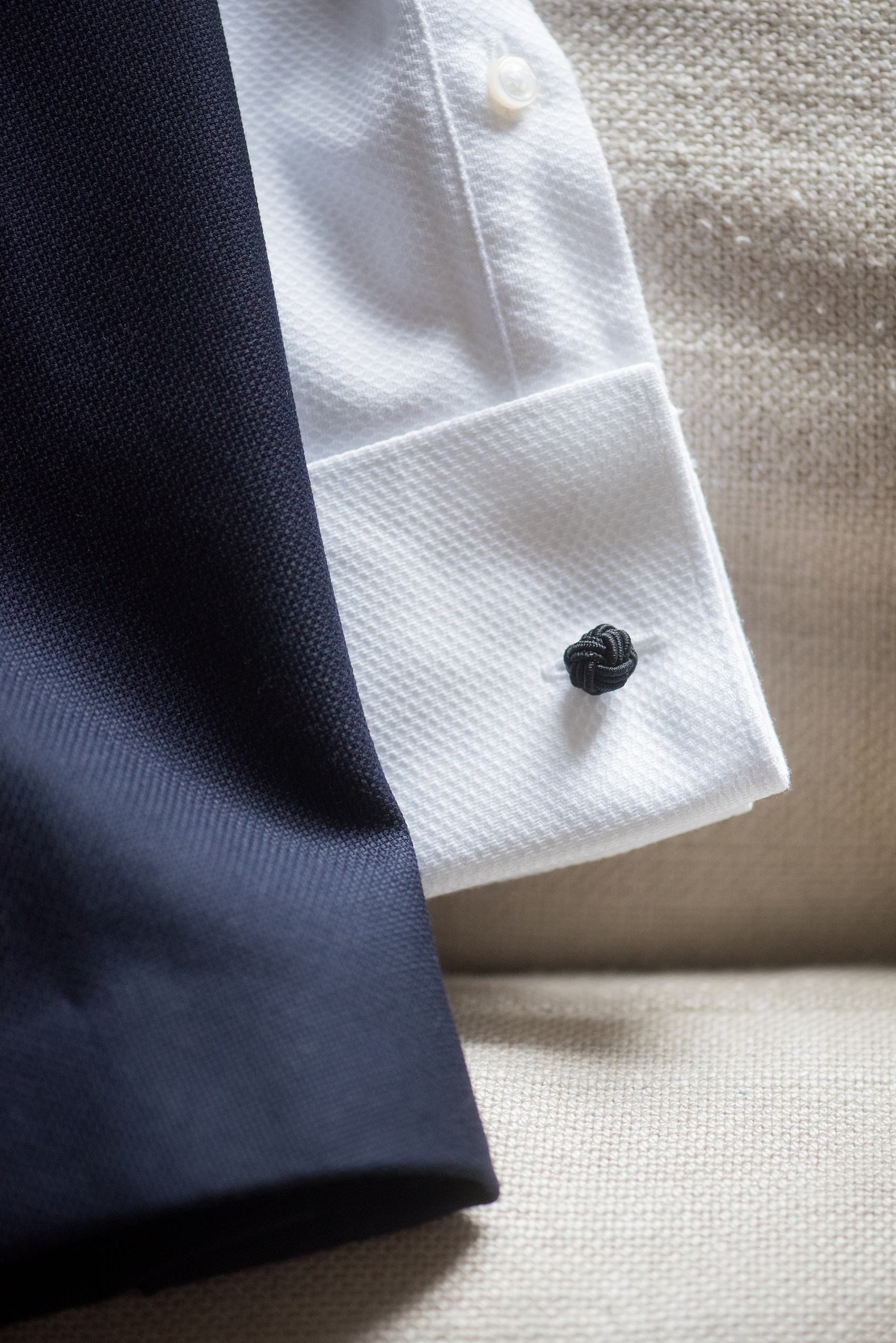 Photos of a NYC wedding venue, Tribeca Rooftop, by Mikkel Paige Photography. This ceremony and reception location has an outdoor space overlooking the Manhattan skyline. These pictures will provide inspiration in New York! The groom wore a simple leaf boutonniere on his navy suit. Click through for more details from this celebration! #TribecaRooftop #MikkelPaige #NYCwedding #NYCWeddingVenues #NYCWeddingPhotography #groomsuit