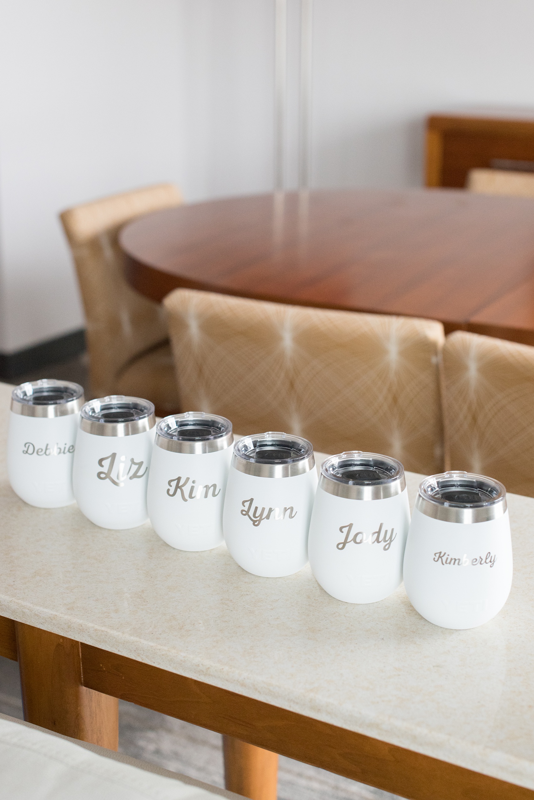 Photos of a NYC wedding venue, Tribeca Rooftop, by Mikkel Paige Photography. This ceremony and reception location has an outdoor space overlooking the Manhattan skyline. These pictures will provide inspiration in New York! The bride gave her bridesmaids white Yeti cups with their names on them. Click through for more details from this celebration! #TribecaRooftop #MikkelPaige #NYCwedding #NYCWeddingVenues #NYCWeddingPhotography #Yetis #BridesmaidsGifts