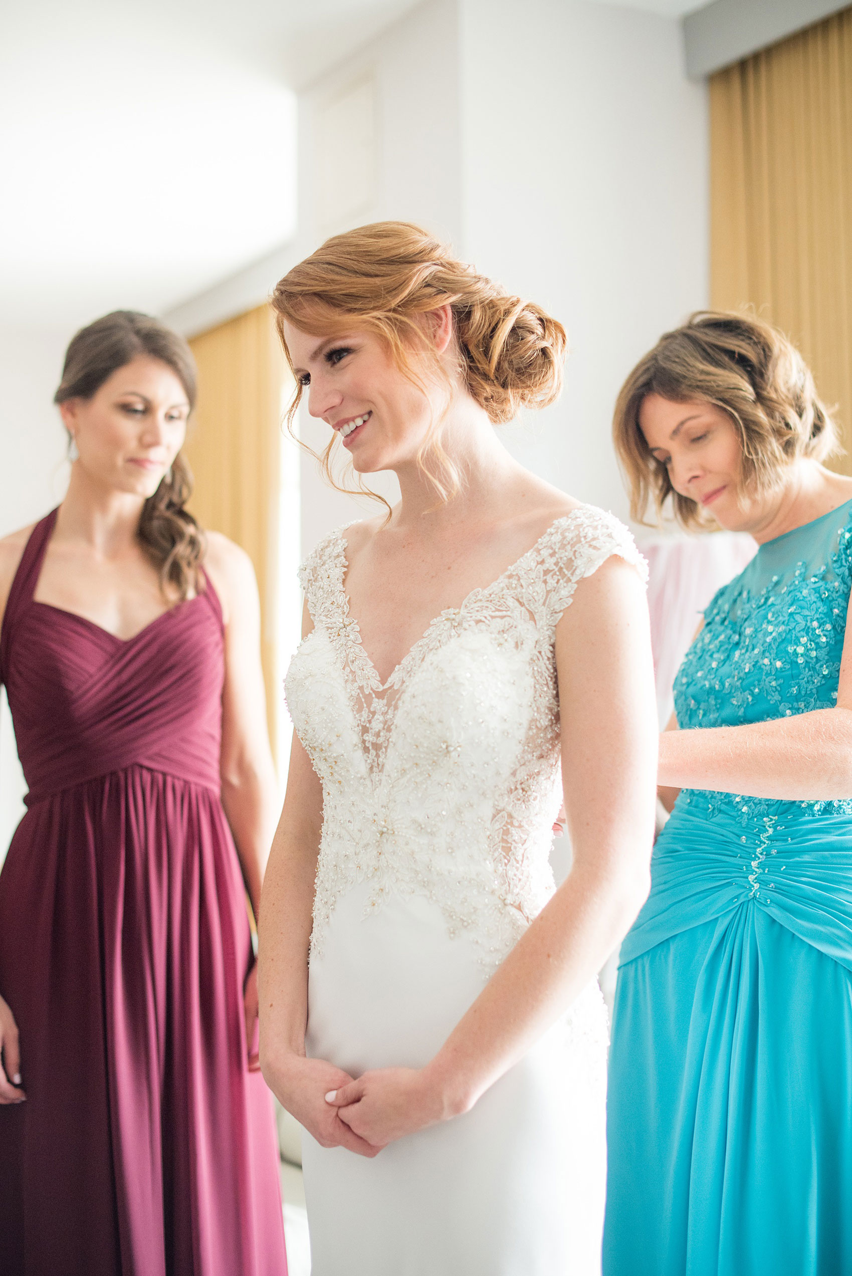 Photos of a NYC wedding venue, Tribeca Rooftop, by Mikkel Paige Photography. This ceremony and reception location has an outdoor space overlooking the Manhattan skyline. These pictures will provide inspiration in New York! The bride wore a lace illusion gown with beading, her hair up, and carried a bouquet of fall flowers. Click through for more details from this celebration! #TribecaRooftop #MikkelPaige #NYCwedding #NYCWeddingVenues #NYCWeddingPhotography #BridalGown #RKBridal