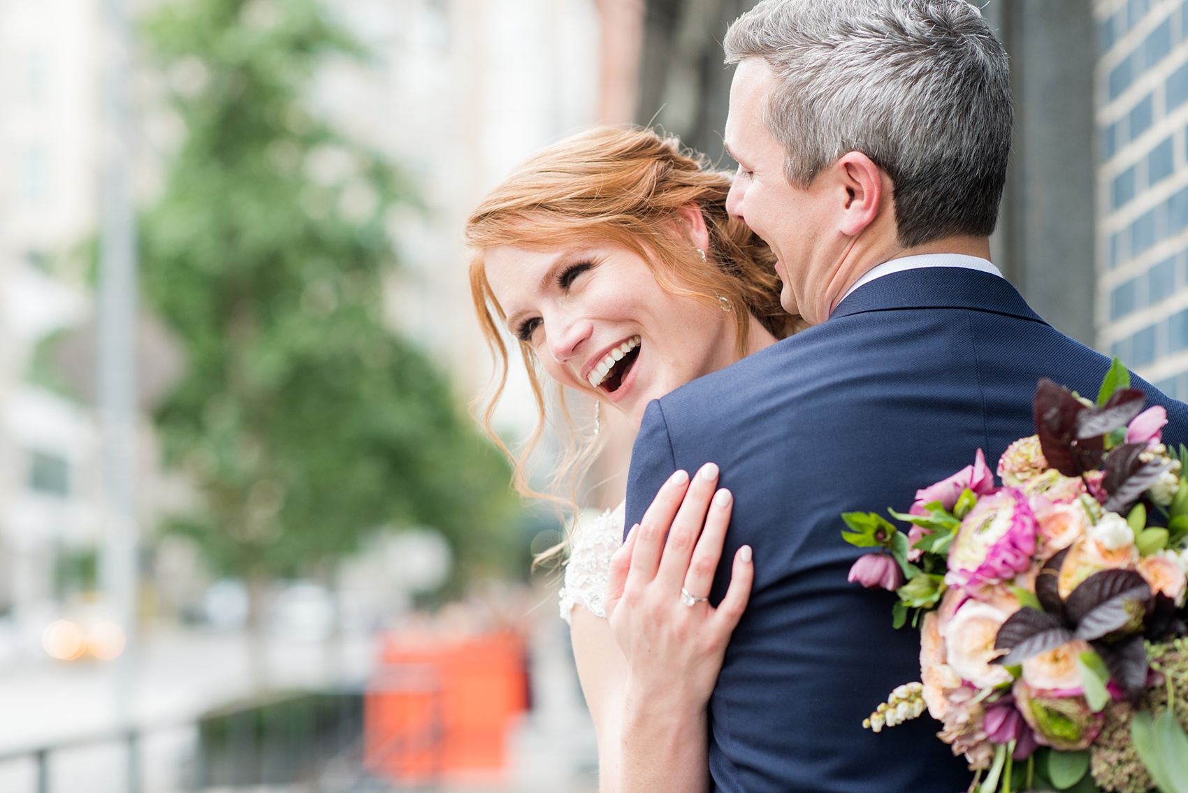 Photos of a NYC wedding venue, Tribeca Rooftop, by Mikkel Paige Photography. This ceremony and reception location has an outdoor space overlooking the Manhattan skyline. These pictures of the bride and groom will provide inspiration in New York! She wore a lace illusion gown with beading, her hair up, and carried a bouquet of fall flowers and he was in a navy suit. Click through for more details from this celebration! #TribecaRooftop #MikkelPaige #NYCwedding #NYCWeddingVenues #BrideandGroom 