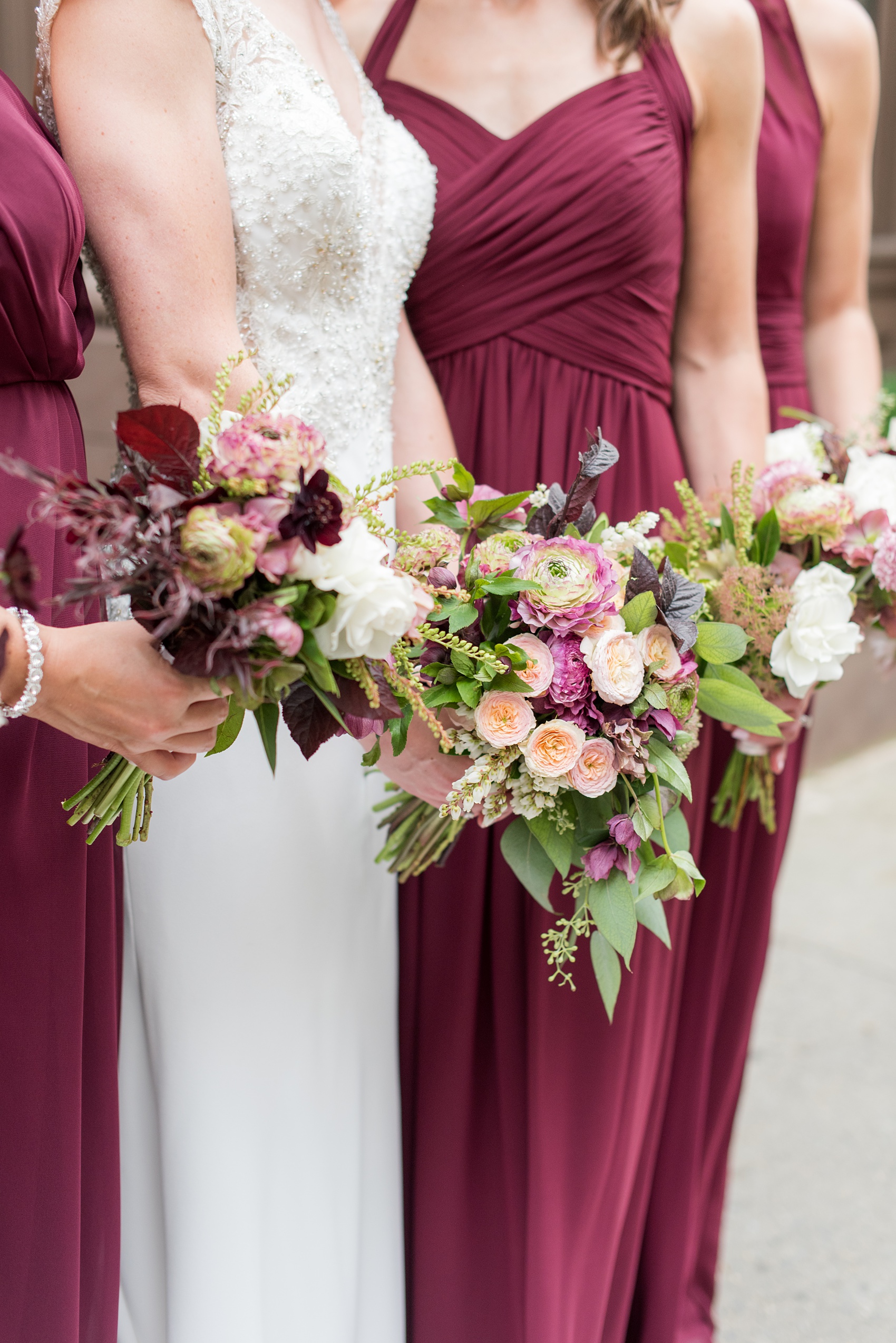 Photos of a NYC wedding venue, Tribeca Rooftop, by Mikkel Paige Photography. This ceremony and reception location has an outdoor space overlooking the Manhattan skyline. These pictures will provide inspiration in New York! Fall flowers were plentiful in bouquets and centerpieces, including red, purples, whites and pinks. Click through for more details from this celebration! #TribecaRooftop #MikkelPaige #NYCwedding #NYCWeddingVenues #NYCWeddingPhotography #FallFlowers #Ranunculus #Dahlias