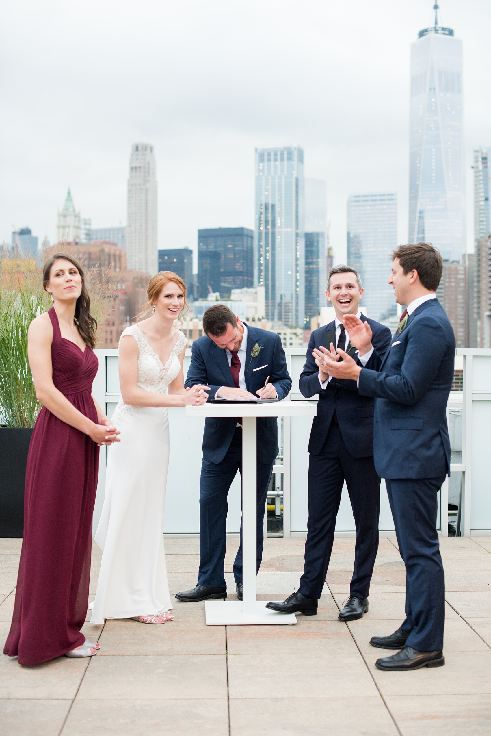 Photos of a NYC wedding venue, Tribeca Rooftop, by Mikkel Paige Photography. This ceremony and reception location has an outdoor space overlooking the Manhattan skyline. These pictures will provide inspiration in New York! The couple dreamed of getting married in this awesome city with flowers and colors of fall. Click through for more details from this beautiful celebration! #TribecaRooftop #NYCVenues #MikkelPaige #NYCwedding #NYCskyline #NYCWeddingPhotos #NYCWeddingPhotography