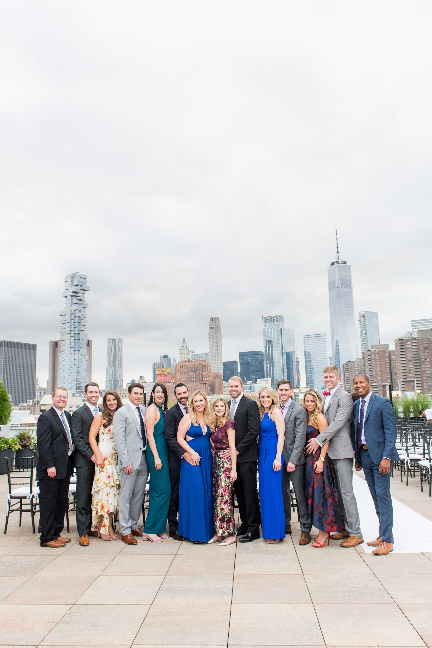 Photos of a NYC wedding venue, Tribeca Rooftop, by Mikkel Paige Photography. This ceremony and reception location has an outdoor space overlooking the Manhattan skyline. These pictures will provide inspiration in New York! The couple dreamed of getting married in this awesome city with flowers and colors of fall. Click through for more details from this beautiful celebration! #TribecaRooftop #NYCVenues #MikkelPaige #NYCwedding #NYCskyline #NYCWeddingPhotos #NYCWeddingPhotography #cocktailhour