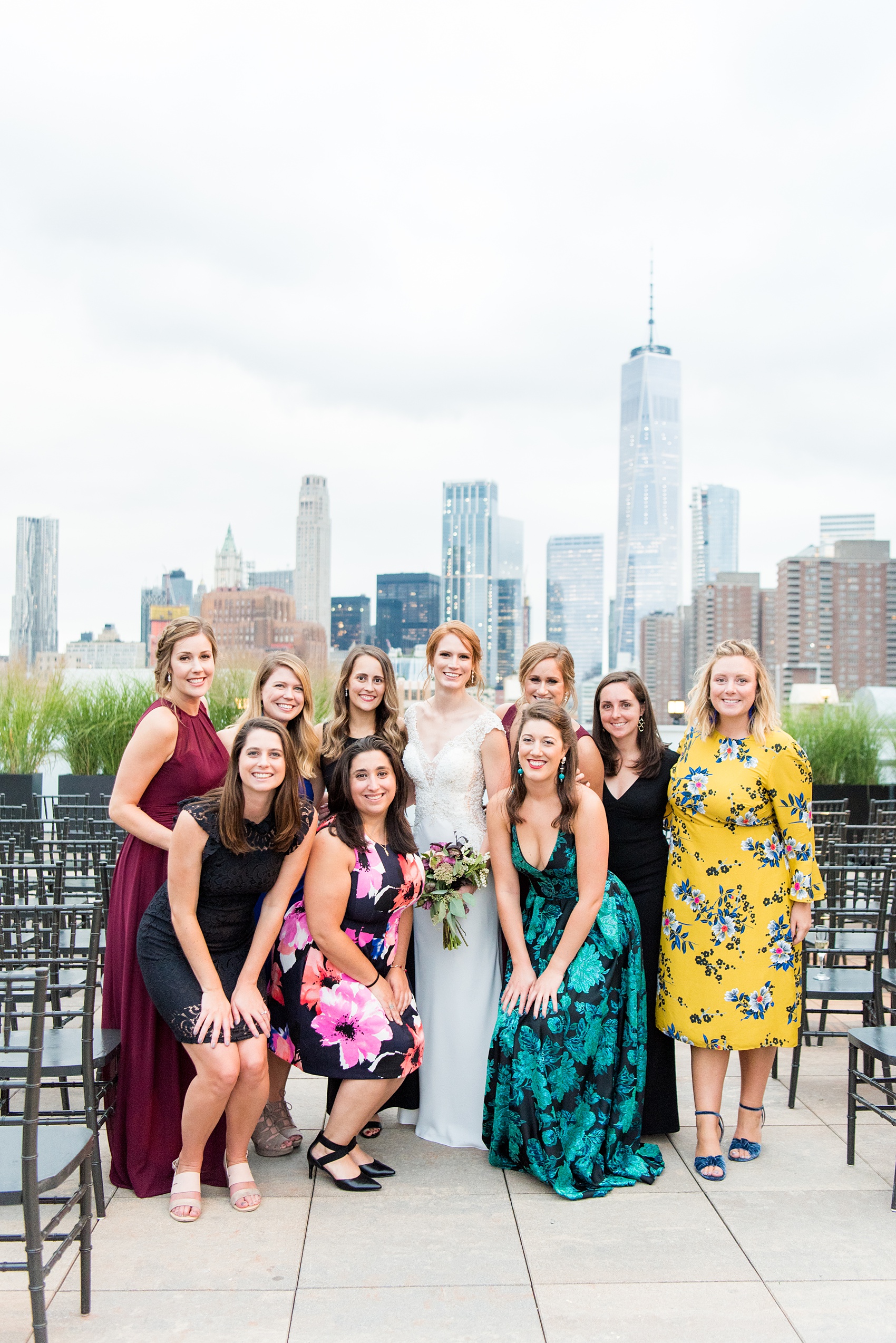 Photos of a NYC wedding venue, Tribeca Rooftop, by Mikkel Paige Photography. This ceremony and reception location has an outdoor space overlooking the Manhattan skyline. These pictures will provide inspiration in New York! The couple dreamed of getting married in this awesome city with flowers and colors of fall. Click through for more details from this beautiful celebration! #TribecaRooftop #NYCVenues #MikkelPaige #NYCwedding #NYCskyline #NYCWeddingPhotos #NYCWeddingPhotography #cocktailhour