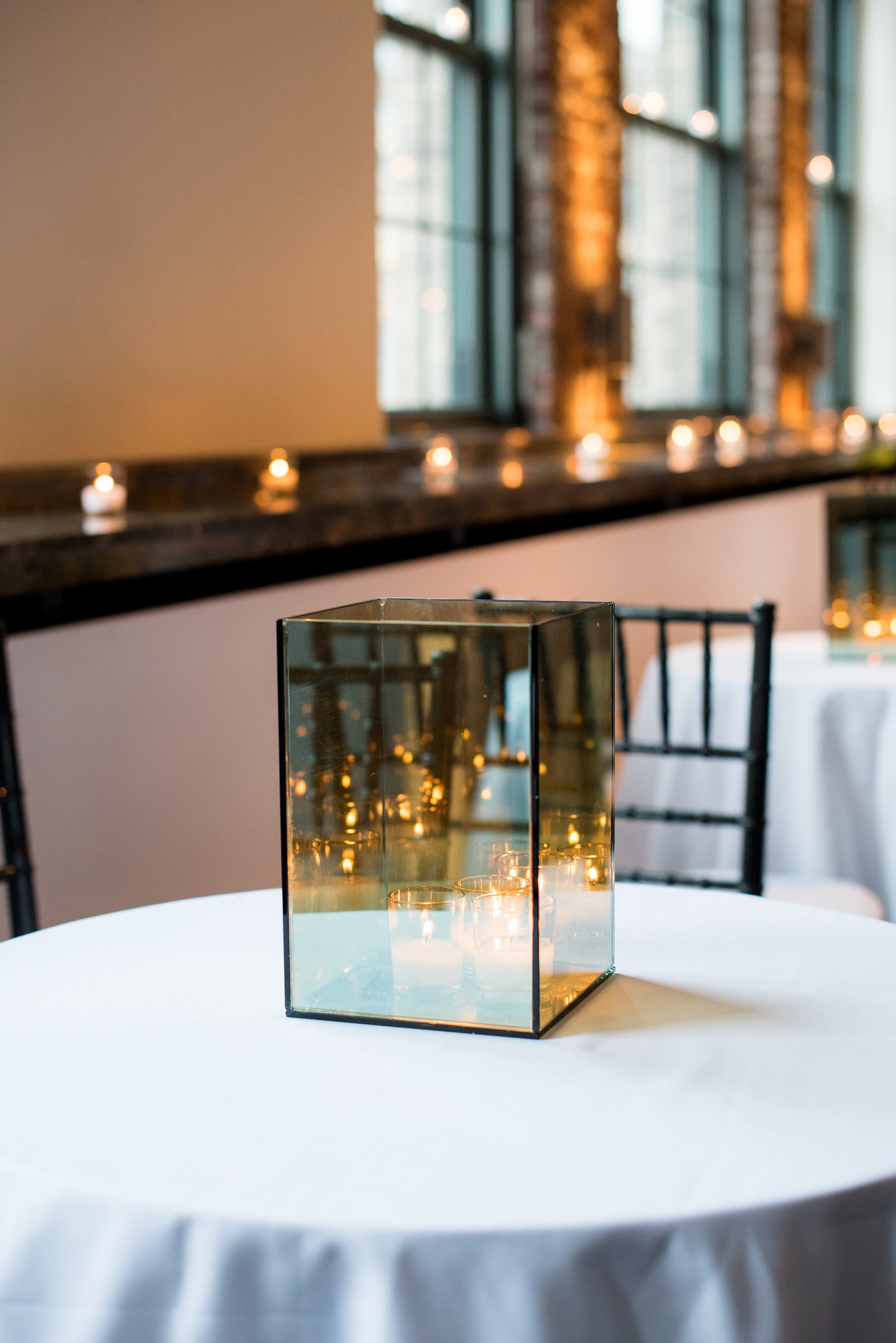 Photos of a NYC wedding venue, Tribeca Rooftop, by Mikkel Paige Photography. This ceremony and reception location has an outdoor space overlooking the Manhattan skyline. These pictures will provide inspiration in New York! Fall flowers were plentiful in bouquets and centerpieces, including red, purples, whites and pinks. Click through for more details from this celebration! #TribecaRooftop #MikkelPaige #NYCwedding #NYCWeddingVenues #NYCWeddingPhotography #candlelight