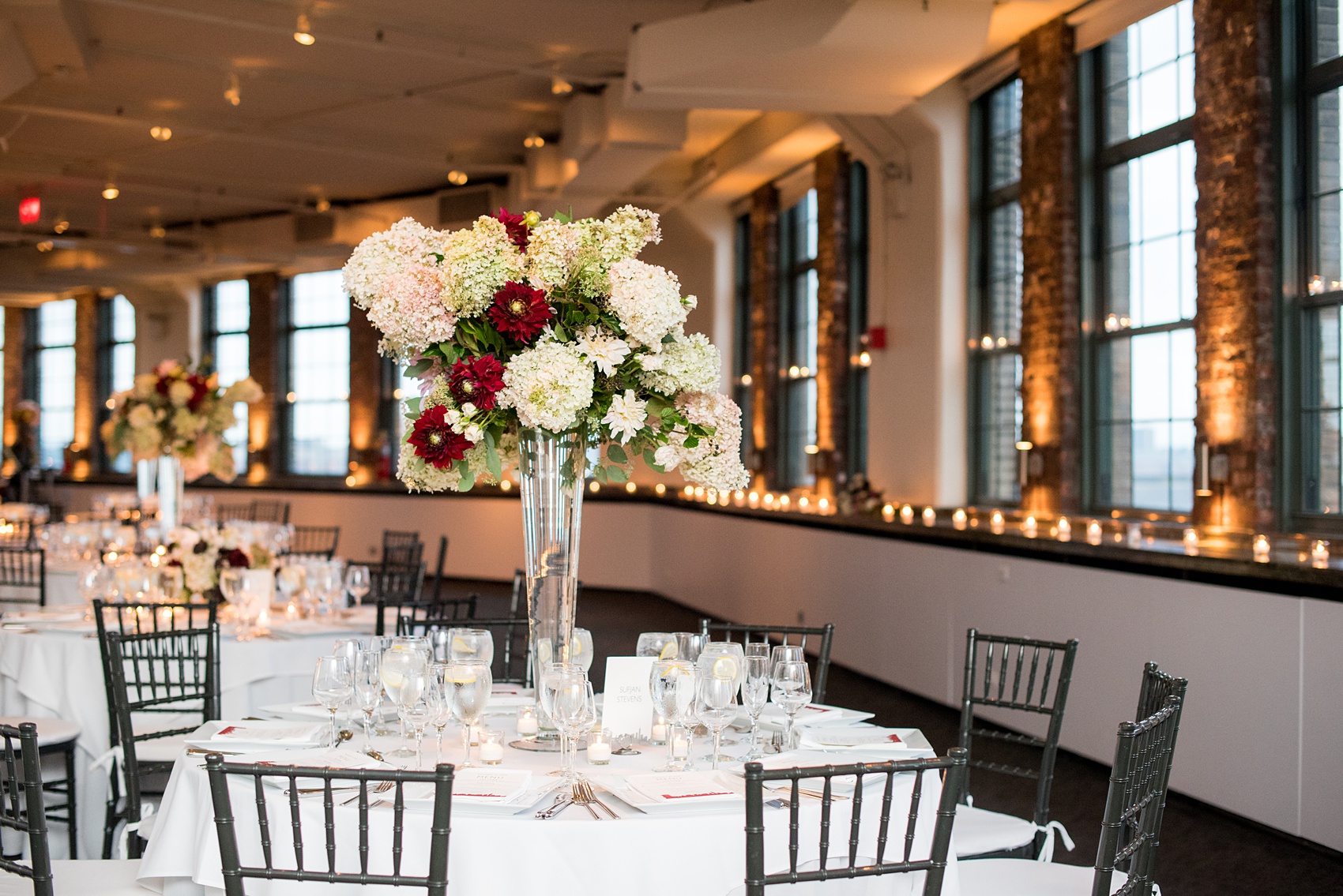 Photos of a NYC wedding venue, Tribeca Rooftop, by Mikkel Paige Photography. This ceremony and reception location has an outdoor space overlooking the Manhattan skyline. These pictures will provide inspiration in New York! The couple dreamed of getting married in this awesome city with flowers and colors of fall. Click through for more details from this beautiful celebration! #TribecaRooftop #NYCVenues #MikkelPaige #NYCwedding #NYCskyline #NYCWeddingPhotos #NYCWeddingPhotography 