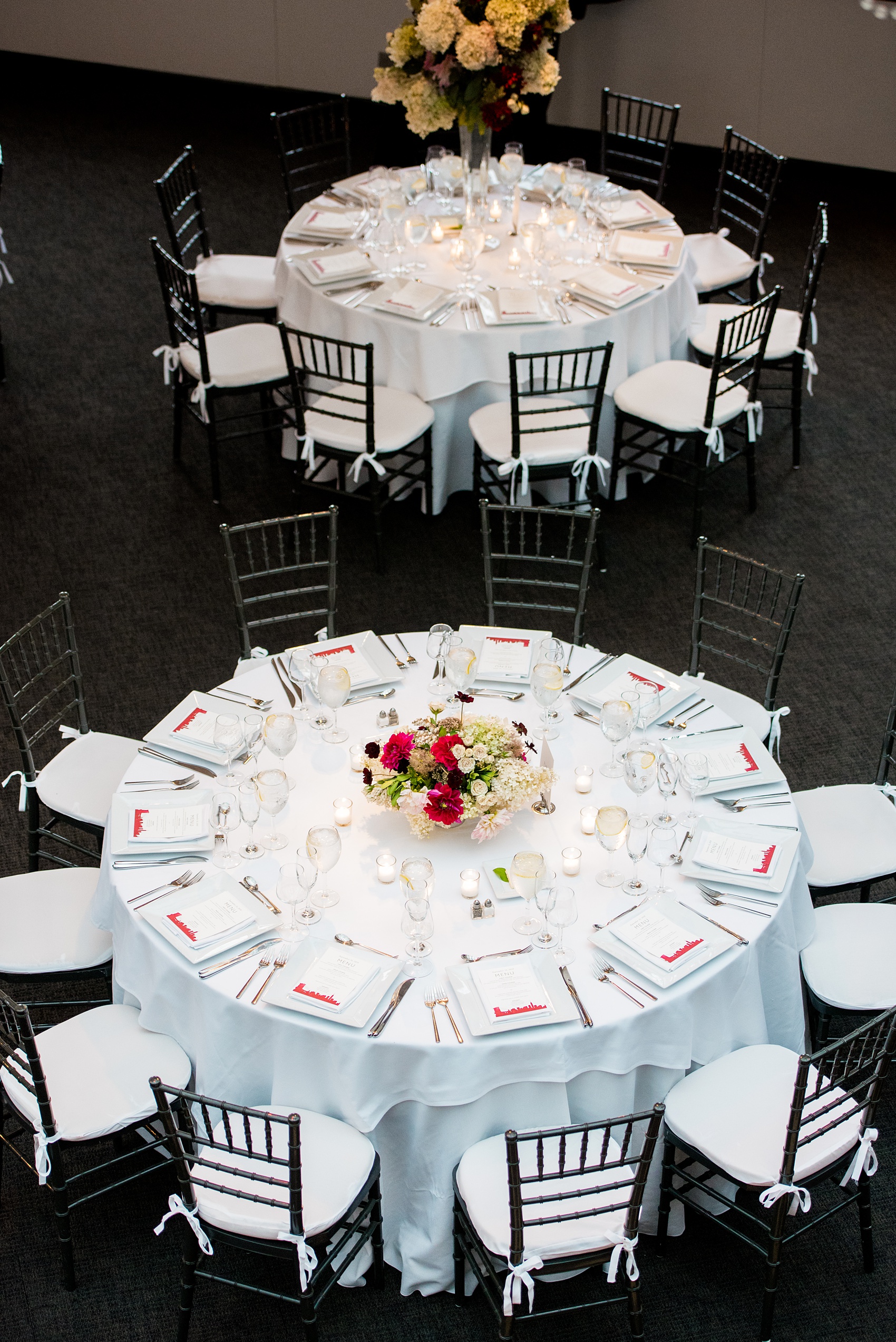 Photos of a NYC wedding venue, Tribeca Rooftop, by Mikkel Paige Photography. This ceremony and reception location has an outdoor space overlooking the Manhattan skyline. These pictures will provide inspiration in New York! The couple dreamed of getting married in this awesome city with flowers and colors of fall. Click through for more details from this beautiful celebration! #TribecaRooftop #NYCVenues #MikkelPaige #NYCwedding #NYCskyline #NYCWeddingPhotos #NYCWeddingPhotography 