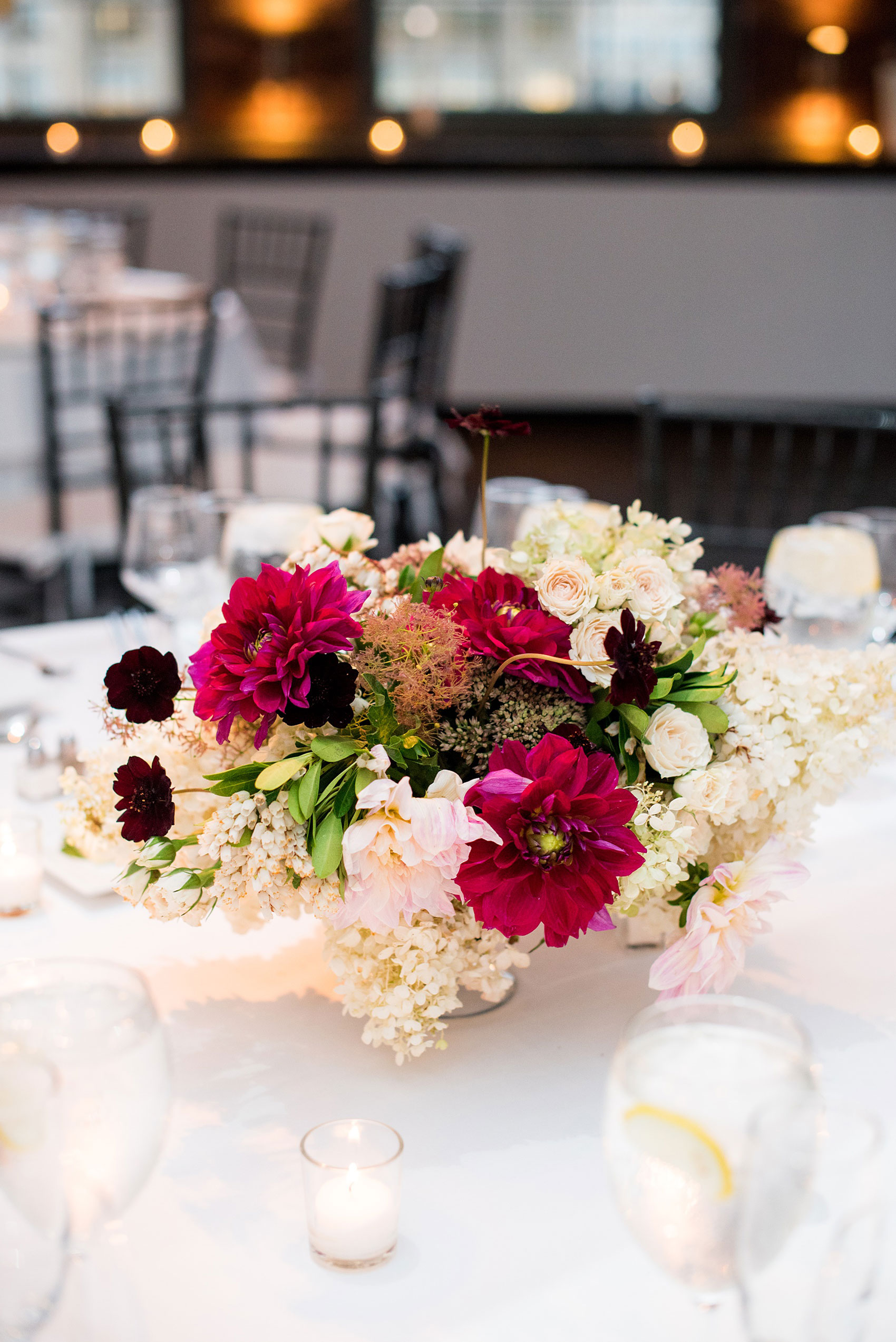 Photos of a NYC wedding venue, Tribeca Rooftop, by Mikkel Paige Photography. This ceremony and reception location has an outdoor space overlooking the Manhattan skyline. These pictures will provide inspiration in New York! The couple dreamed of getting married in this awesome city with flowers and colors of fall. Click through for more details from this beautiful celebration! #TribecaRooftop #NYCVenues #MikkelPaige #NYCwedding #NYCskyline #NYCWeddingPhotos #NYCWeddingPhotography 