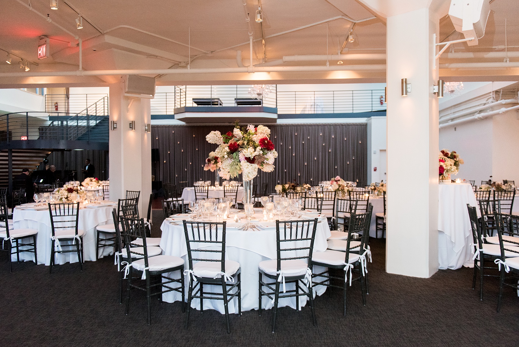 Photos of a NYC wedding venue, Tribeca Rooftop, by Mikkel Paige Photography. This ceremony and reception location has an outdoor space overlooking the Manhattan skyline. These pictures will provide inspiration in New York! The couple dreamed of getting married in this awesome city with flowers and colors of fall. Click through for more details from this beautiful celebration! #TribecaRooftop #NYCVenues #MikkelPaige #NYCwedding #NYCskyline #NYCWeddingPhotos #NYCWeddingPhotography 