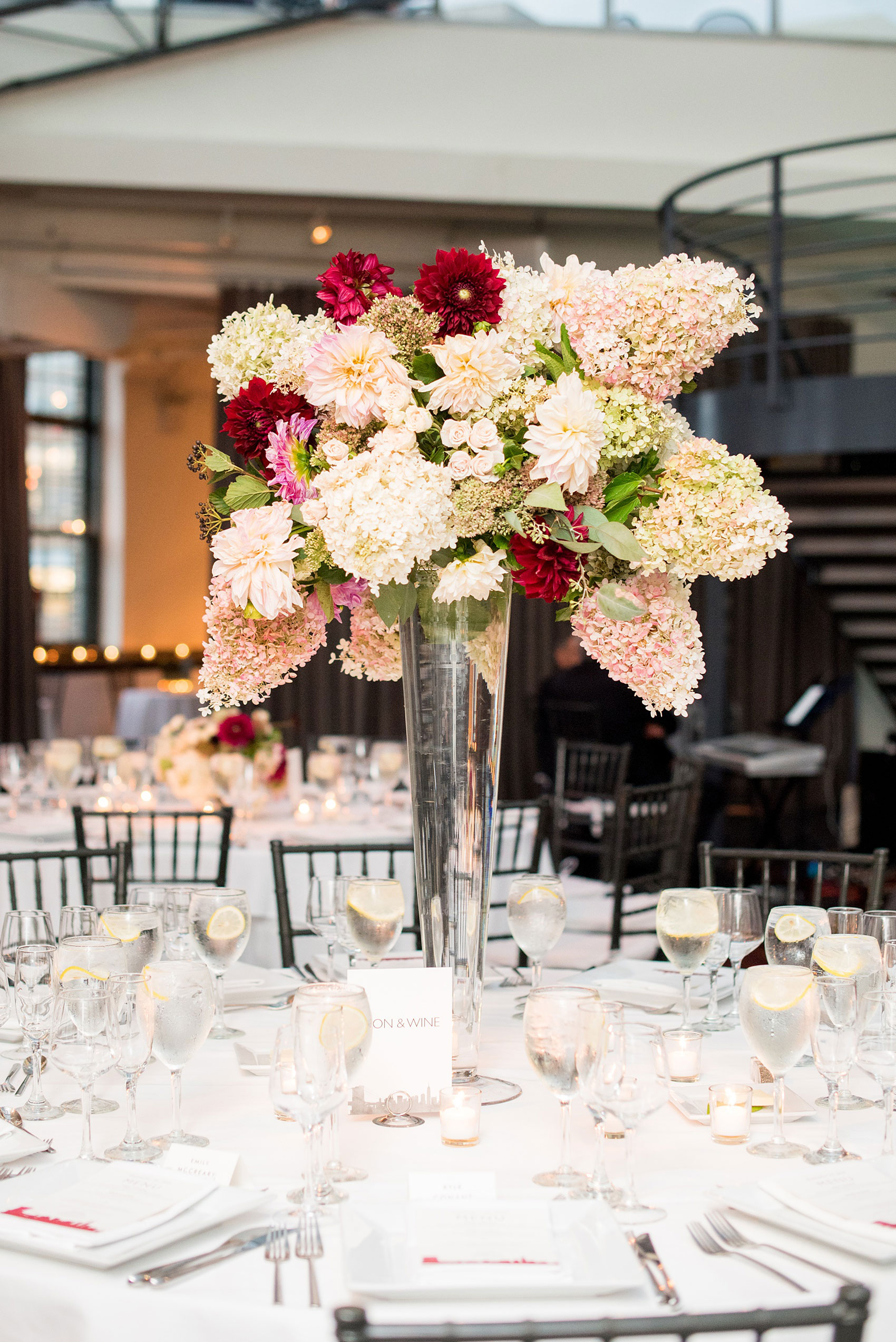 Photos of a NYC wedding venue, Tribeca Rooftop, by Mikkel Paige Photography. This ceremony and reception location has an outdoor space overlooking the Manhattan skyline. These pictures will provide inspiration in New York! The couple dreamed of getting married in this awesome city with flowers and colors of fall. Click through for more details from this beautiful celebration! #TribecaRooftop #NYCVenues #MikkelPaige #NYCwedding #NYCskyline #NYCWeddingPhotos #NYCWeddingPhotography 