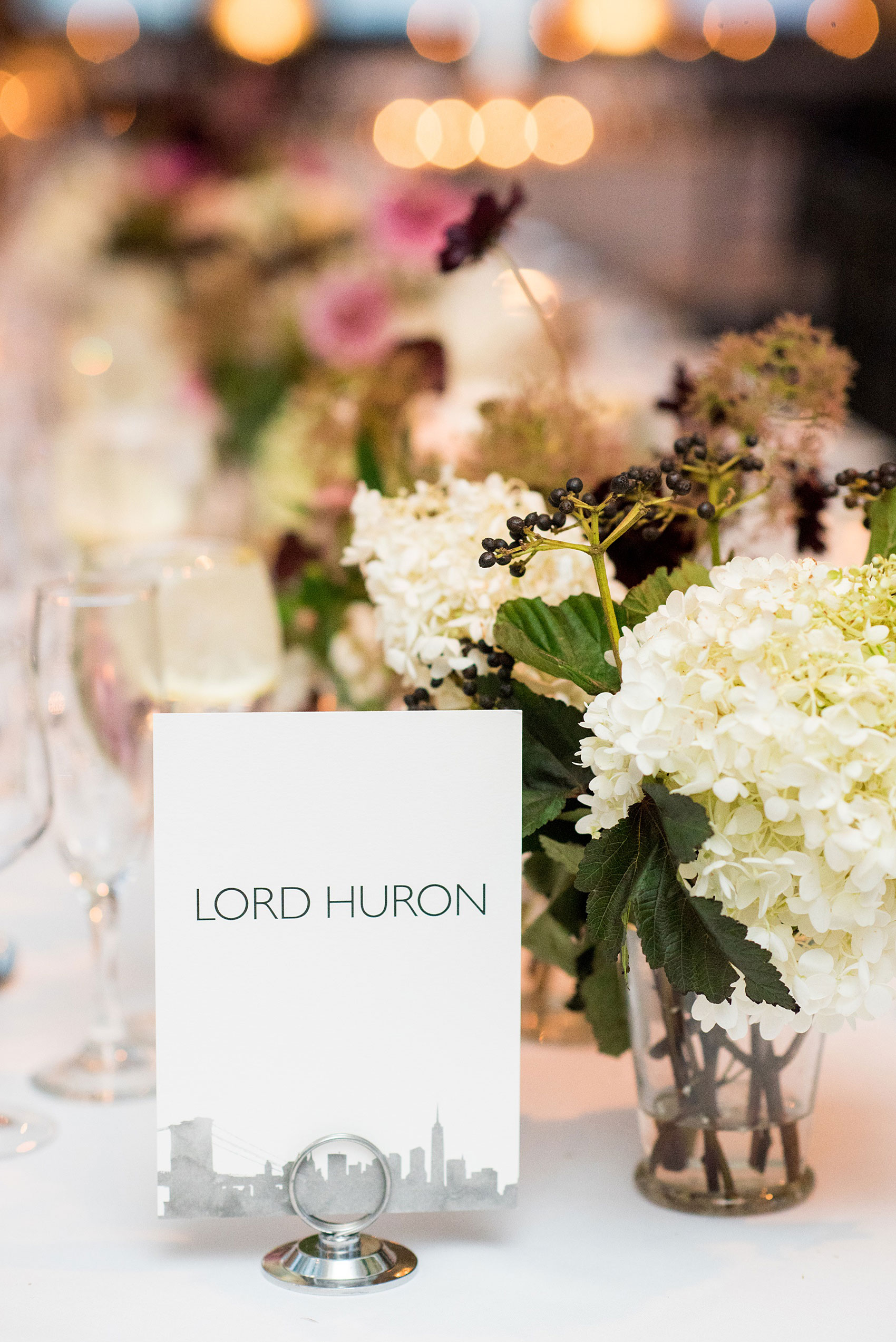Photos of a NYC wedding venue, Tribeca Rooftop, by Mikkel Paige Photography. This ceremony and reception location has an outdoor space overlooking the Manhattan skyline. These pictures will provide inspiration in New York! The couple dreamed of getting married in this awesome city with flowers and colors of fall. Click through for more details from this beautiful celebration! #TribecaRooftop #NYCVenues #MikkelPaige #NYCwedding #NYCskyline #NYCWeddingPhotos #NYCWeddingPhotography #LordHuron 