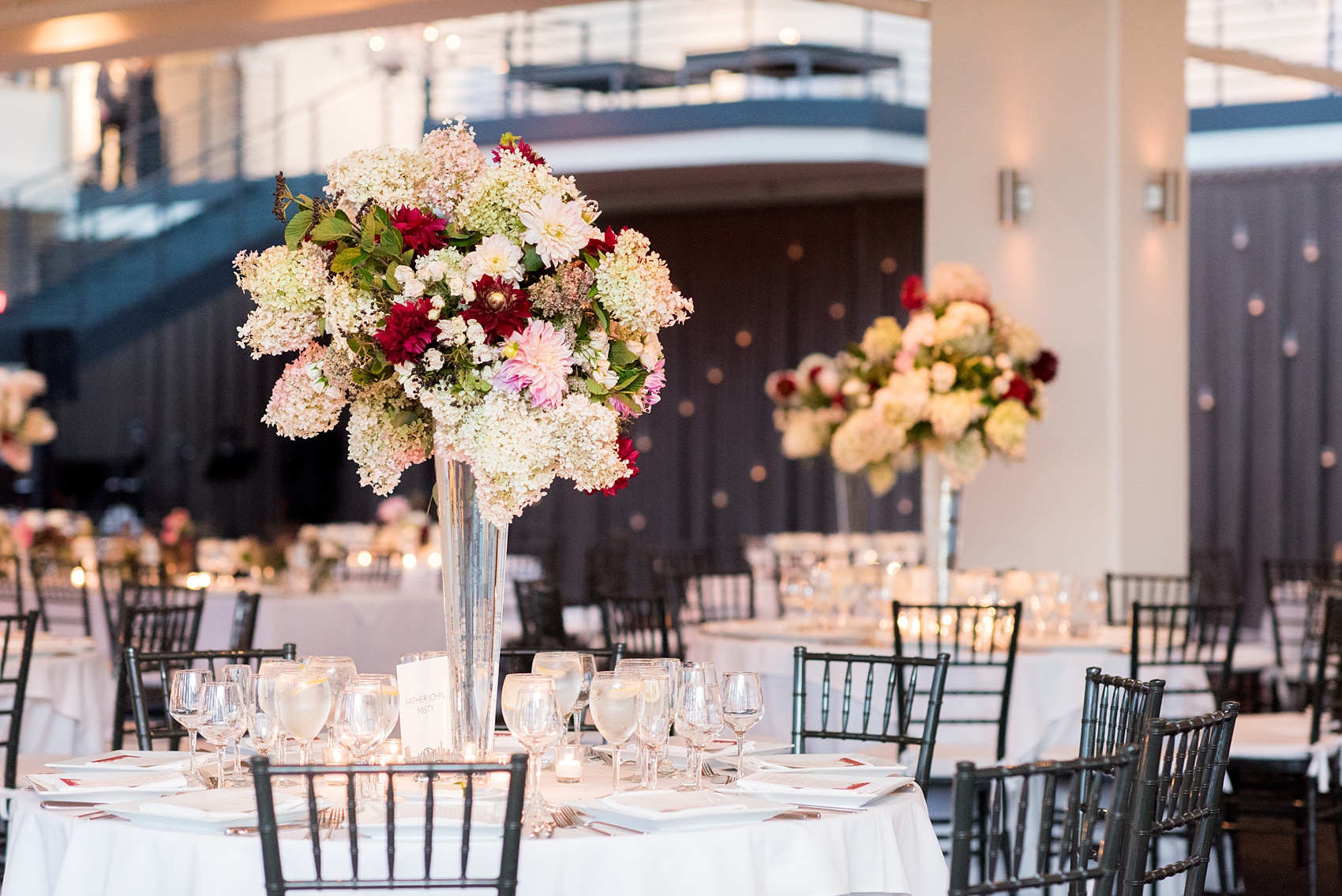Photos of a NYC wedding venue, Tribeca Rooftop, by Mikkel Paige Photography. This ceremony and reception location has an outdoor space overlooking the Manhattan skyline. These pictures will provide inspiration in New York! The couple dreamed of getting married in this awesome city with flowers and colors of fall. Click through for more details from this beautiful celebration! #TribecaRooftop #NYCVenues #MikkelPaige #NYCwedding #NYCskyline #NYCWeddingPhotos #NYCWeddingPhotography 