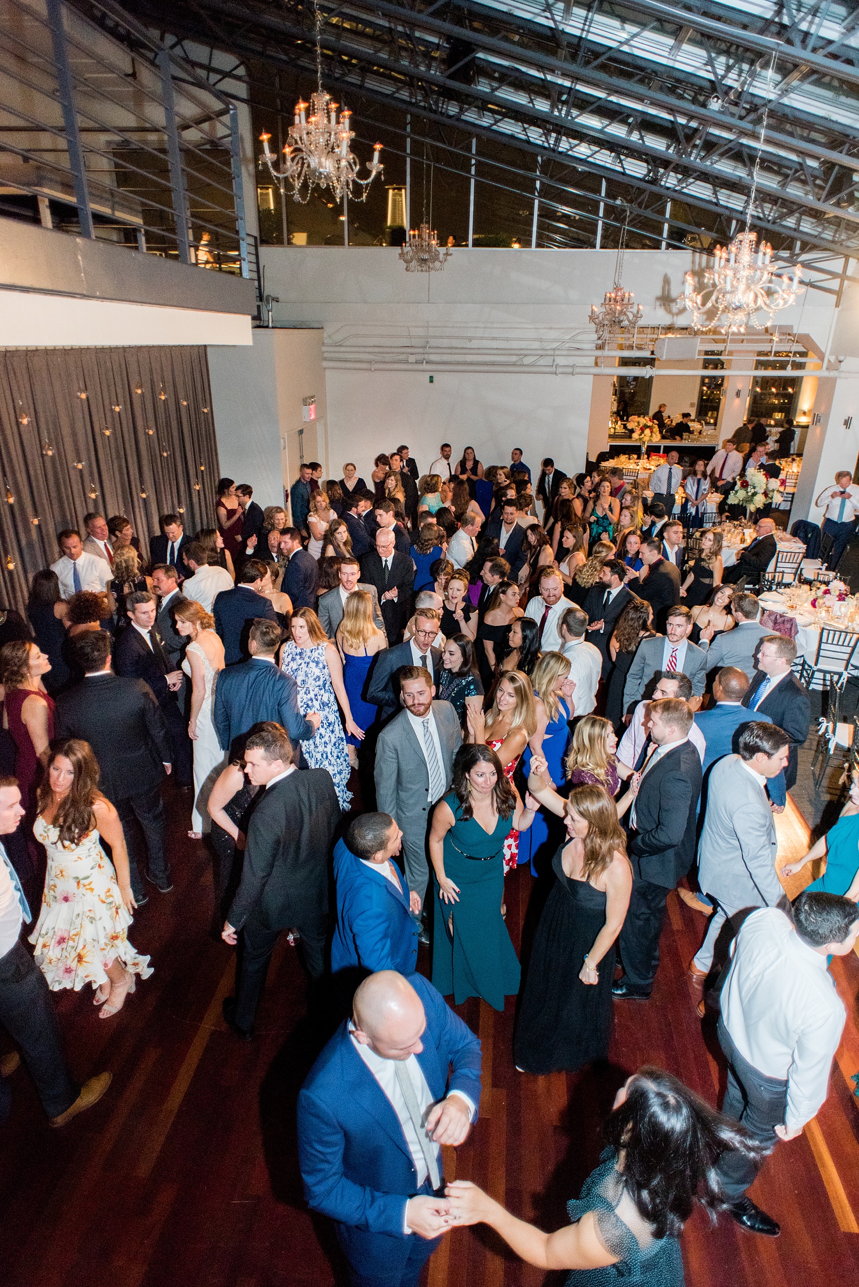 Photos of a NYC wedding venue, Tribeca Rooftop, by Mikkel Paige Photography. This ceremony and reception location has an outdoor space overlooking the Manhattan skyline. These pictures will provide inspiration in New York! The couple dreamed of getting married in this awesome city with flowers and colors of fall. Click through for more details from this beautiful celebration! #TribecaRooftop #NYCVenues #MikkelPaige #NYCwedding #NYCskyline #NYCWeddingPhotos #NYCWeddingPhotography 