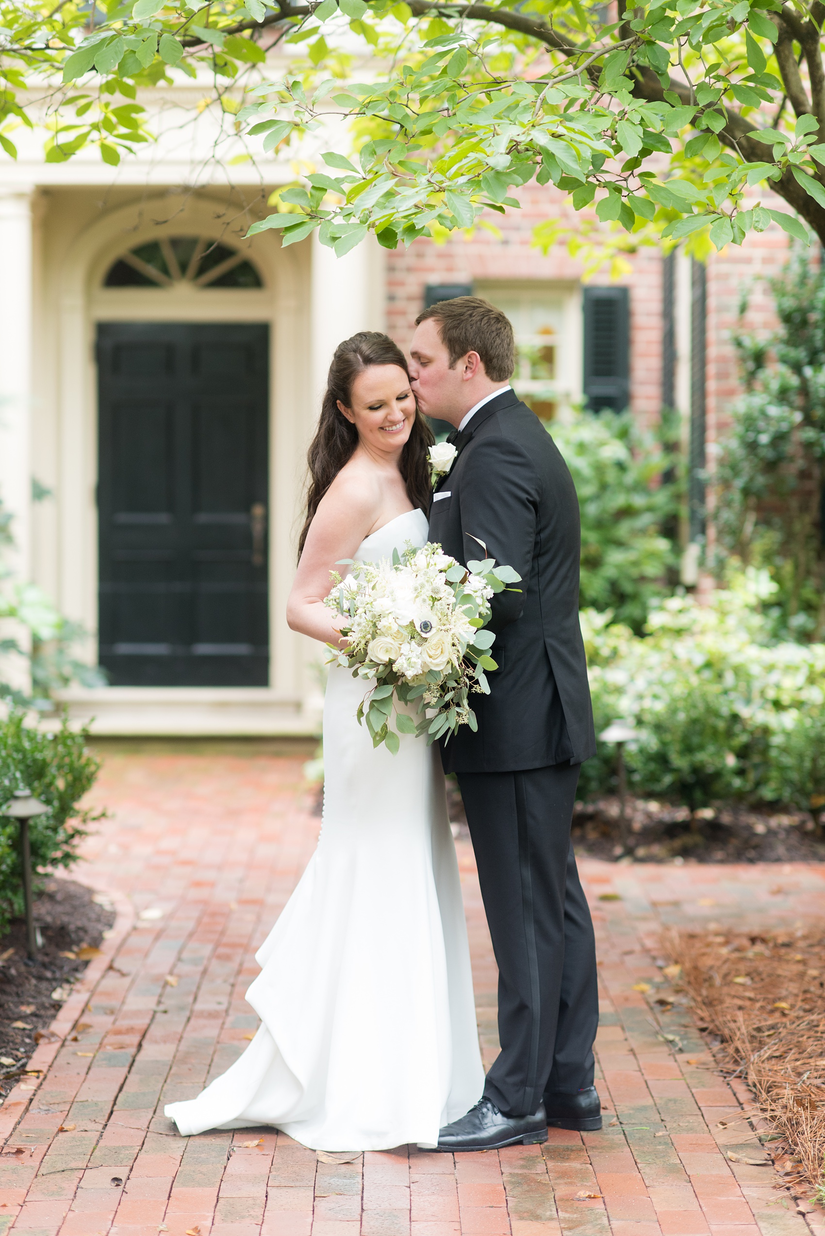 Photos of a fall wedding at The Carolina Inn, in Chapel Hill North Carolina, by Mikkel Paige Photography. This event venue doubles as a hotel for guests, who can enjoy a reception and ceremony indoors or outdoors. The bride wore a beautiful, simple white gown with a v-neck cut out and a cathedral length veil and groom a classic black tuxedo. Click through to see inspiration from the entire wedding! Planner: @asouthernsoiree #thecarolinainn #ChapelHillWeddings #MikkelPaige #bride #bridestyle