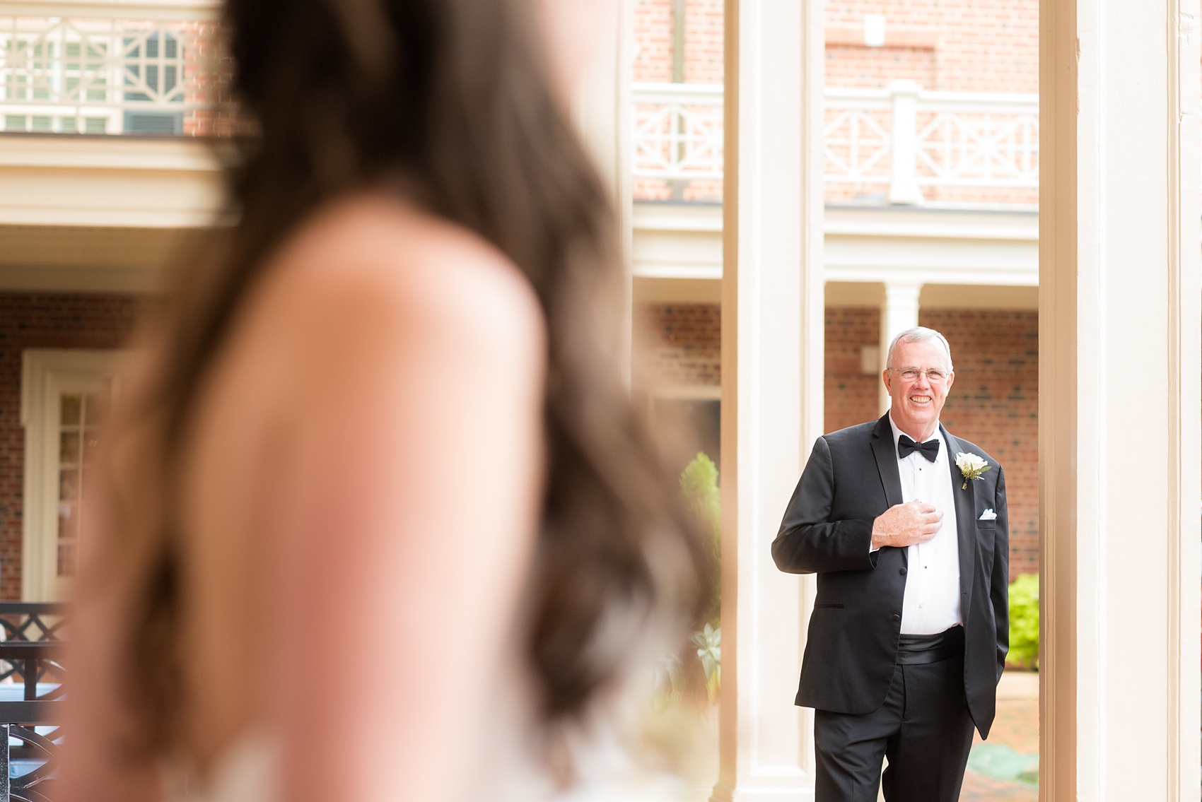 Photos of a fall wedding at The Carolina Inn, in Chapel Hill North Carolina, by Mikkel Paige Photography. This event venue doubles as a hotel for guests, who can enjoy a reception and ceremony indoors or outdoors. The bride’s father was shocked by his beautiful daughter, a bride wearing a simple elegant white gown and cathedral length veil. Click through to see inspiration from the entire wedding! Planner: @asouthernsoiree #thecarolinainn #ChapelHillWeddings #MikkelPaige #bride #fatherofthebride