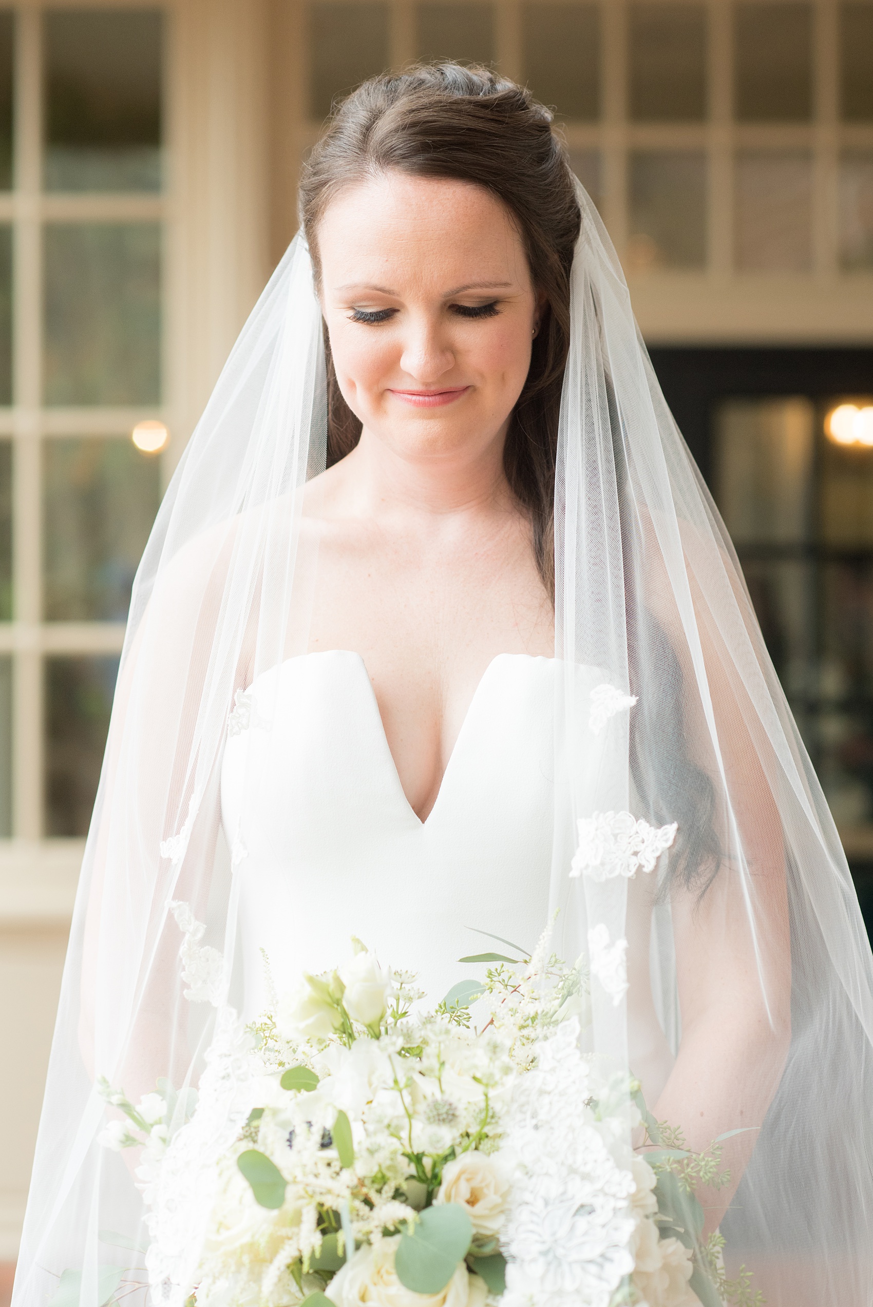 Photos of a fall wedding at The Carolina Inn, in Chapel Hill North Carolina, by Mikkel Paige Photography. This event venue doubles as a hotel for guests, who can enjoy a reception and ceremony indoors or outdoors. The bride wore a beautiful, simple white gown with a v-neck cut out and a cathedral length veil. Click through to see inspiration from the entire wedding! Planner: @asouthernsoiree #thecarolinainn #ChapelHillWeddings #MikkelPaige #ASouthernSoiree #bride #bridestyle #simpleweddinggown