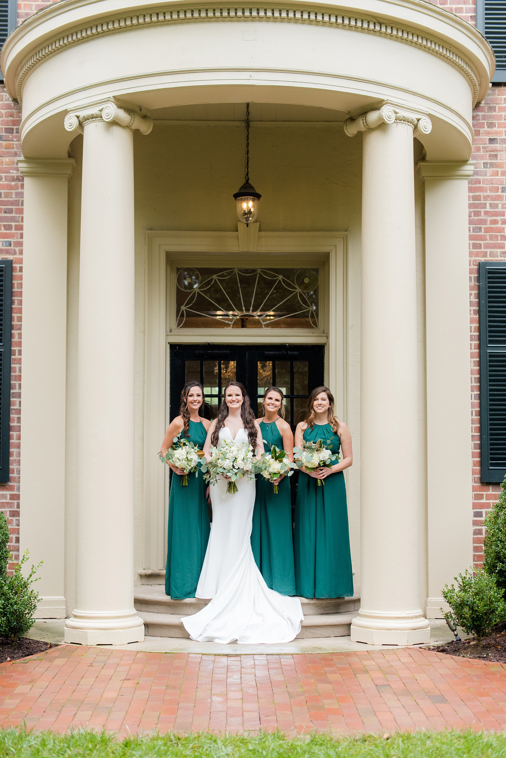Wedding Party Photos of a fall wedding at The Carolina Inn, in Chapel Hill North Carolina, by Mikkel Paige Photography. This event venue doubles as a hotel for guests, who can enjoy a reception indoors or outdoors. The bridesmaids wore long green gowns and carried white bouquets with eucalyptus greenery. Click through to see inspiration from the entire wedding! Planner: @asouthernsoiree, Flowers by The Flower Cupboard #thecarolinainn #ChapelHillWeddings #MikkelPaige #ASouthernSoiree #greenbridesmaids #greenwedding #bridalparty