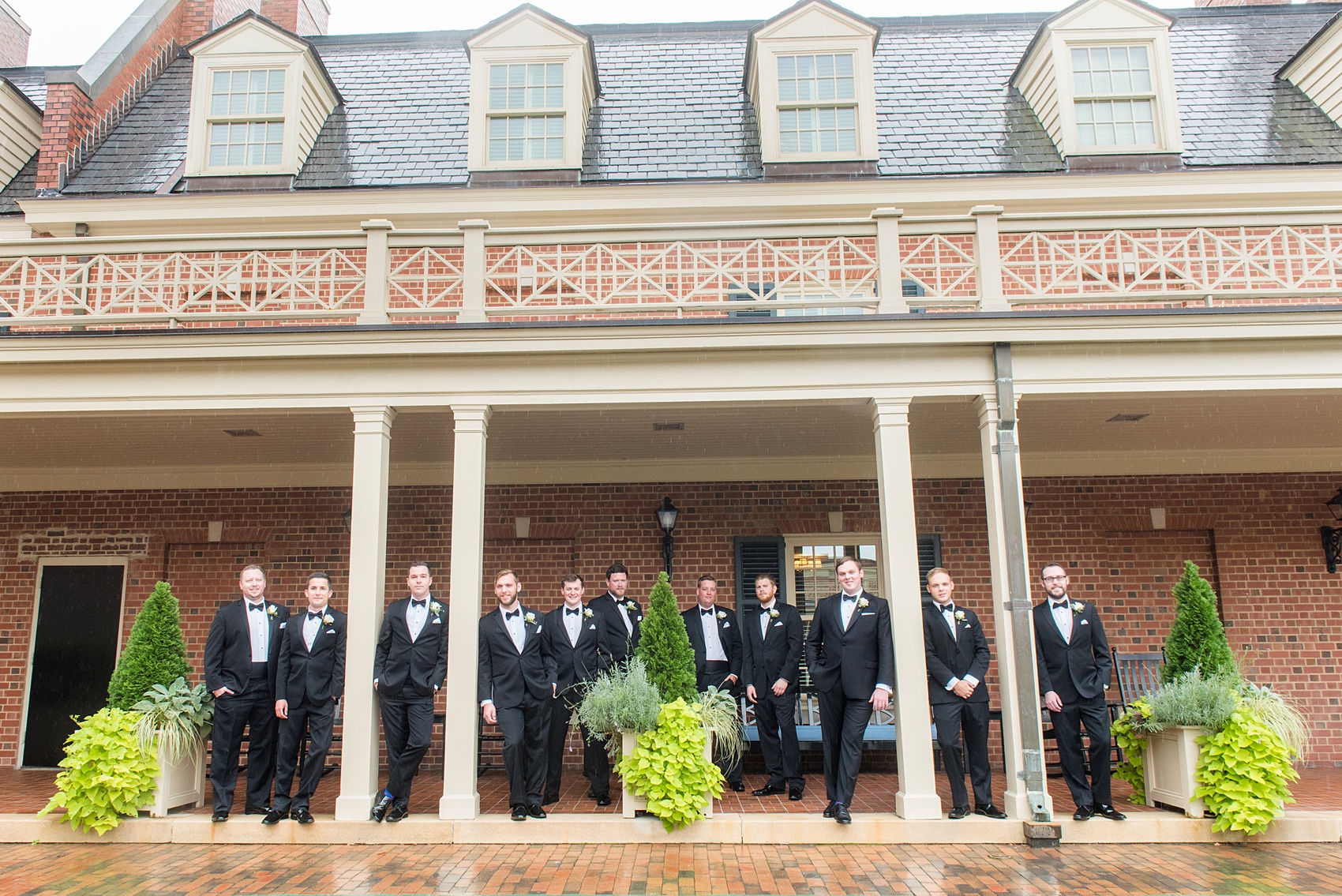 Photos of a fall wedding at The Carolina Inn, in Chapel Hill North Carolina, by Mikkel Paige Photography. This event venue doubles as a hotel for guests, who can enjoy a reception indoors or outdoors. The groomsmen wore classic black tuxedos with white rose boutonnieres by The Flower Cupboard. Click through to see inspiration from the entire wedding! Planner: @asouthernsoiree #thecarolinainn #ChapelHillWeddings #MikkelPaige #ASouthernSoiree #greenwedding #groomsmen #blacktuxedos