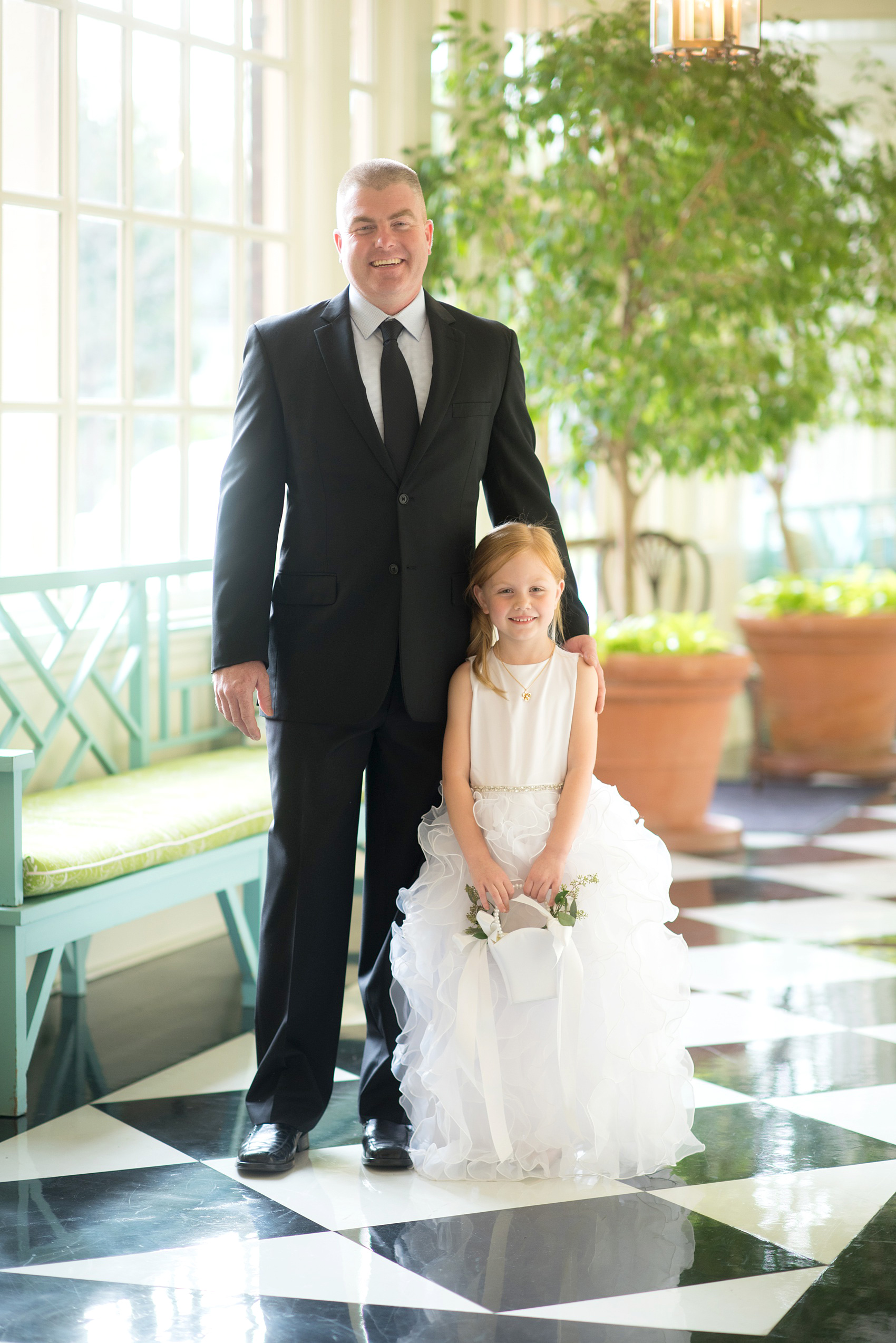 Photos of a fall wedding at The Carolina Inn, in Chapel Hill North Carolina, by Mikkel Paige Photography. This event venue doubles as a hotel for guests, who can enjoy a reception indoors or outdoors. This is the cutest photos of the flower girl and her dad! Click through to see inspiration from the entire wedding! Planner: @asouthernsoiree #thecarolinainn #ChapelHillWeddings #MikkelPaige #ASouthernSoiree #flowergirl