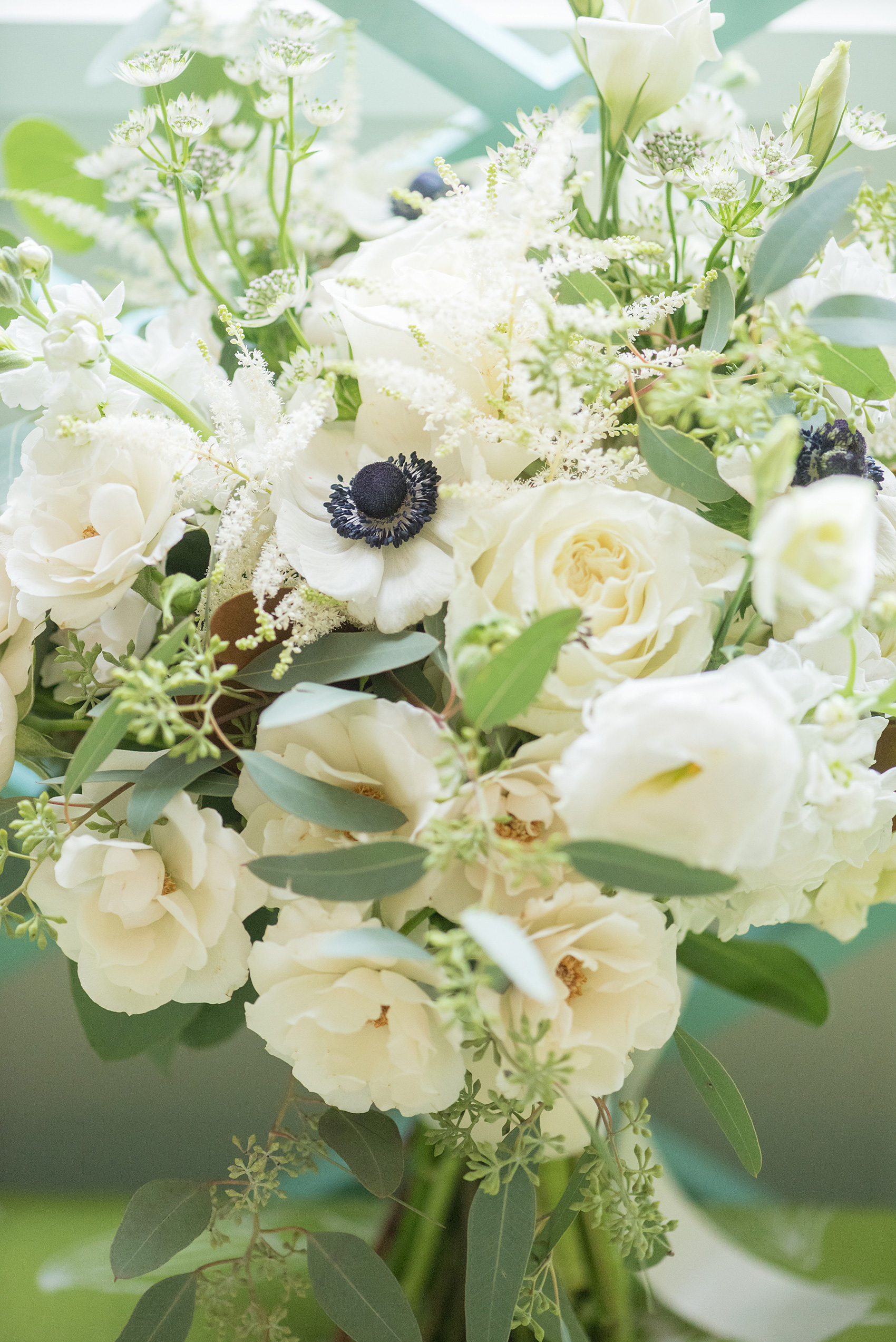 Photos of a fall wedding at The Carolina Inn, in Chapel Hill North Carolina, by Mikkel Paige Photography. This event venue doubles as a hotel for guests, who can enjoy a reception indoors or outdoors. The bride’s bouquet was white with eucalyptus greenery, including lisanthus, anemones with purple centers, and roses by The Flower Cupboard. Click through to see inspiration from the entire wedding! Planner: @asouthernsoiree #thecarolinainn #ChapelHillWeddings #MikkelPaige #bridalbouquet