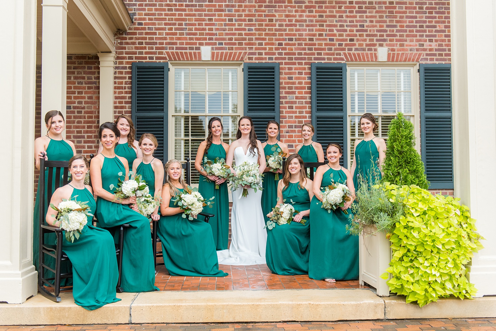 Wedding Party Photos of a fall wedding at The Carolina Inn, in Chapel Hill North Carolina, by Mikkel Paige Photography. This event venue doubles as a hotel for guests, who can enjoy a reception indoors or outdoors. The bridesmaids wore long green gowns and carried white bouquets with eucalyptus greenery. Click through to see inspiration from the entire wedding! Planner: @asouthernsoiree, Flowers by The Flower Cupboard #thecarolinainn #ChapelHillWeddings #MikkelPaige #ASouthernSoiree #greenbridesmaids #greenwedding #bridalparty