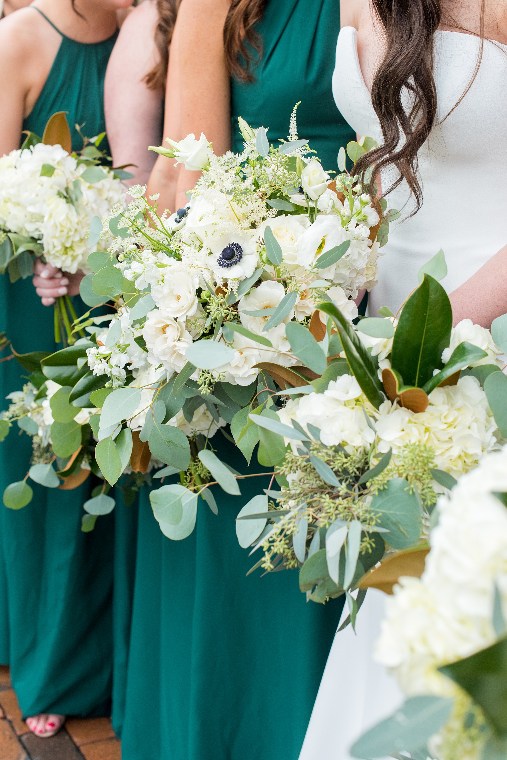 Wedding Party Photos of a fall wedding at The Carolina Inn, in Chapel Hill North Carolina, by Mikkel Paige Photography. This event venue doubles as a hotel for guests, who can enjoy a reception indoors or outdoors. The bridesmaids wore long green gowns and carried white bouquets with eucalyptus greenery. Click through to see inspiration from the entire wedding! Planner: @asouthernsoiree, Flowers by The Flower Cupboard #thecarolinainn #ChapelHillWeddings #MikkelPaige #ASouthernSoiree #greenbridesmaids #greenwedding #bridalparty