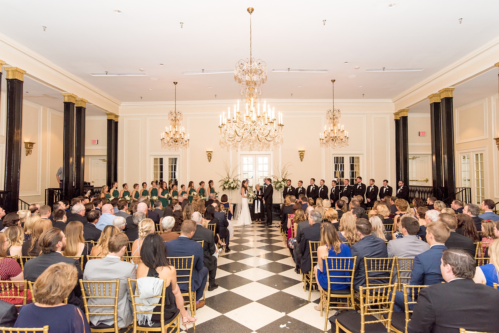 Photos of a fall wedding at The Carolina Inn, in Chapel Hill North Carolina, by Mikkel Paige Photography. This event venue doubles as a hotel for guests, who can enjoy a reception indoors or outdoors. Their ceremony was in the iconic checkerboard Old Mill room with a black and white tile floor. Click through to see inspiration from the entire wedding! Planner: @asouthernsoiree #thecarolinainn #ChapelHillWeddings #MikkelPaige #ASouthernSoiree #indoorceremony