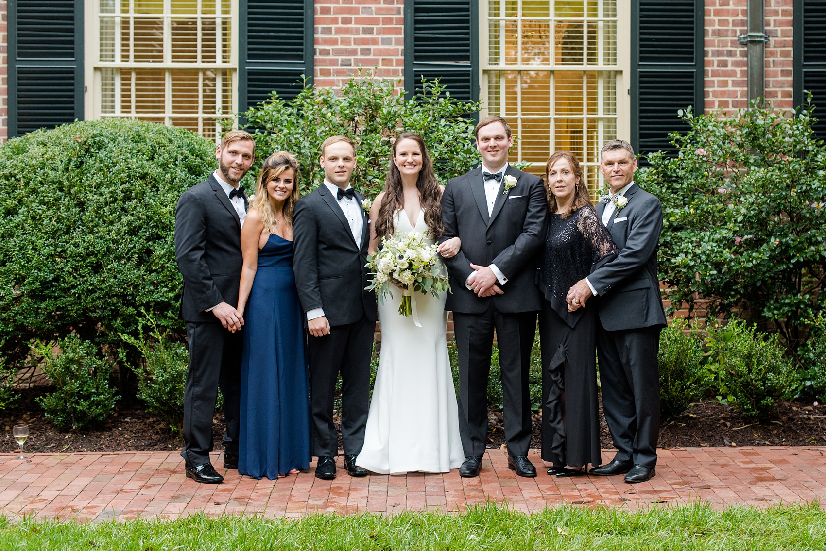 Photos of a fall wedding at The Carolina Inn, in Chapel Hill North Carolina, by Mikkel Paige Photography. This event venue doubles as a hotel for guests, who can enjoy a reception and ceremony indoors or outdoors. Their iconic ballroom and courtyards and gardens are great for photos of the bride, groom and their bridal party. Click through to see all of this wedding - you’ll love the inspiration! Planning by @@asouthernsoiree #thecarolinainn #ChapelHillWeddings #MikkelPaige