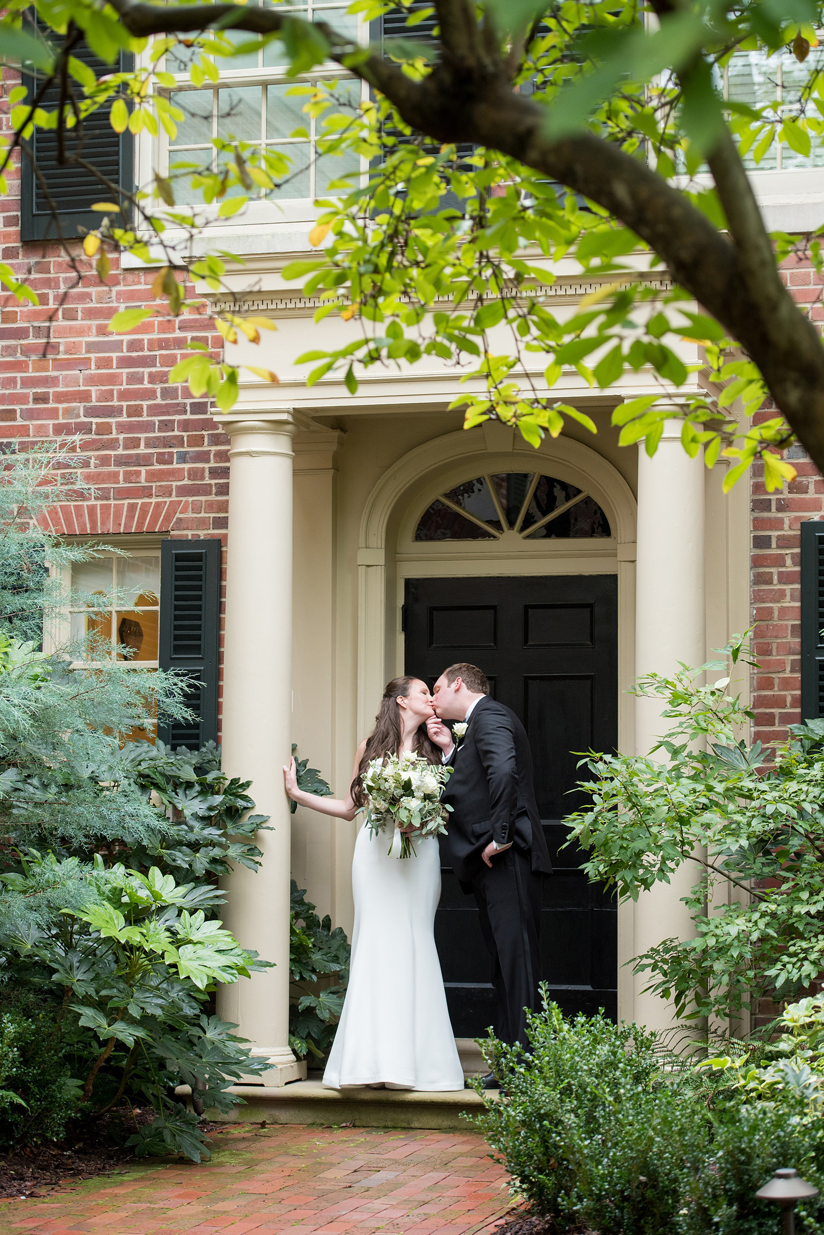 Photos of a fall wedding at The Carolina Inn, in Chapel Hill North Carolina, by Mikkel Paige Photography. This event venue doubles as a hotel for guests, who can enjoy a reception and ceremony indoors or outdoors. The bride wore a beautiful, simple white gown with a v-neck cut out and a cathedral length veil and groom a classic black tuxedo. Click through to see inspiration from the entire wedding! Planner: @asouthernsoiree #thecarolinainn #ChapelHillWeddings #MikkelPaige #bride #bridestyle