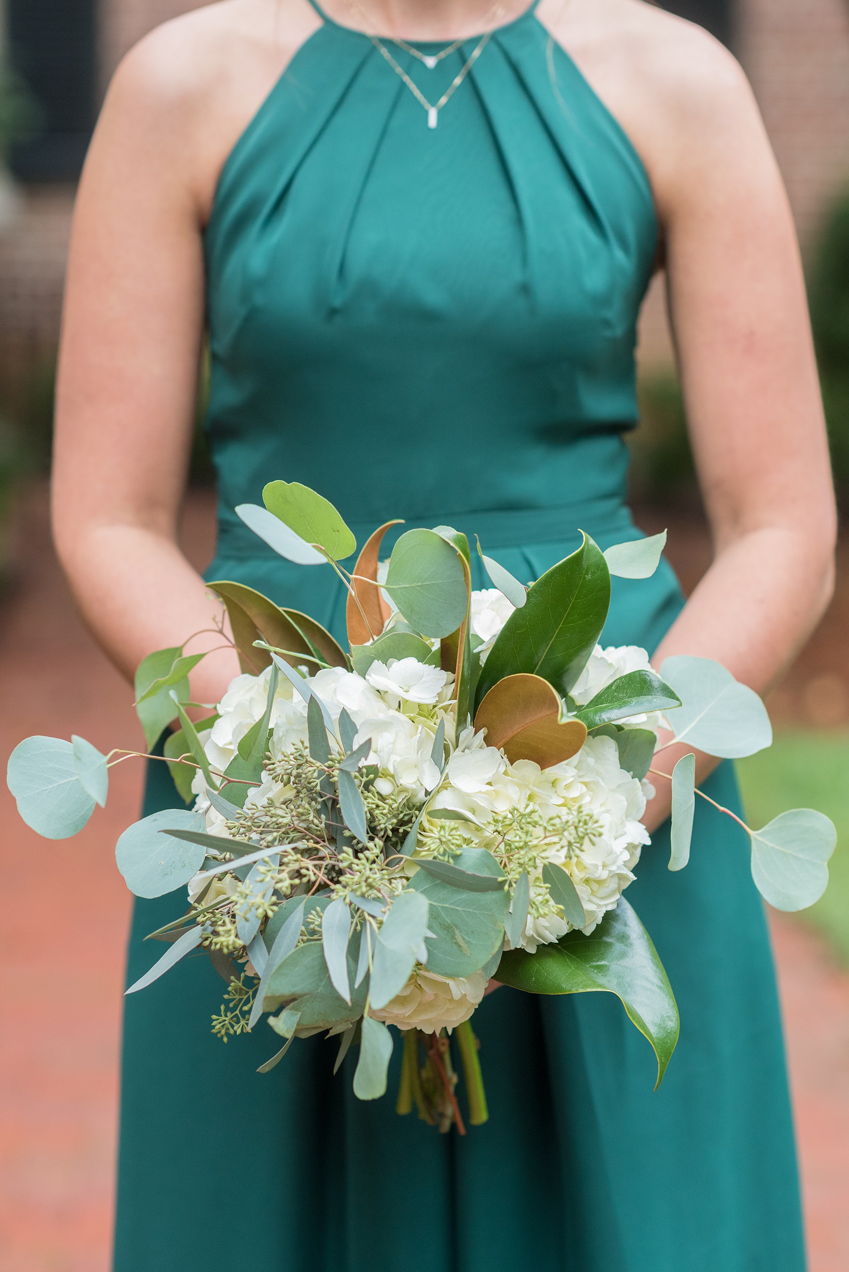 Wedding Party Photos of a fall wedding at The Carolina Inn, in Chapel Hill North Carolina, by Mikkel Paige Photography. This event venue doubles as a hotel for guests, who can enjoy a reception indoors or outdoors. The bridesmaids wore long green gowns and carried white bouquets with eucalyptus greenery. Click through to see inspiration from the entire wedding! Planner: @asouthernsoiree, Flowers by The Flower Cupboard #thecarolinainn #ChapelHillWeddings #MikkelPaige #ASouthernSoiree #greenbridesmaids #greenwedding #bridalparty