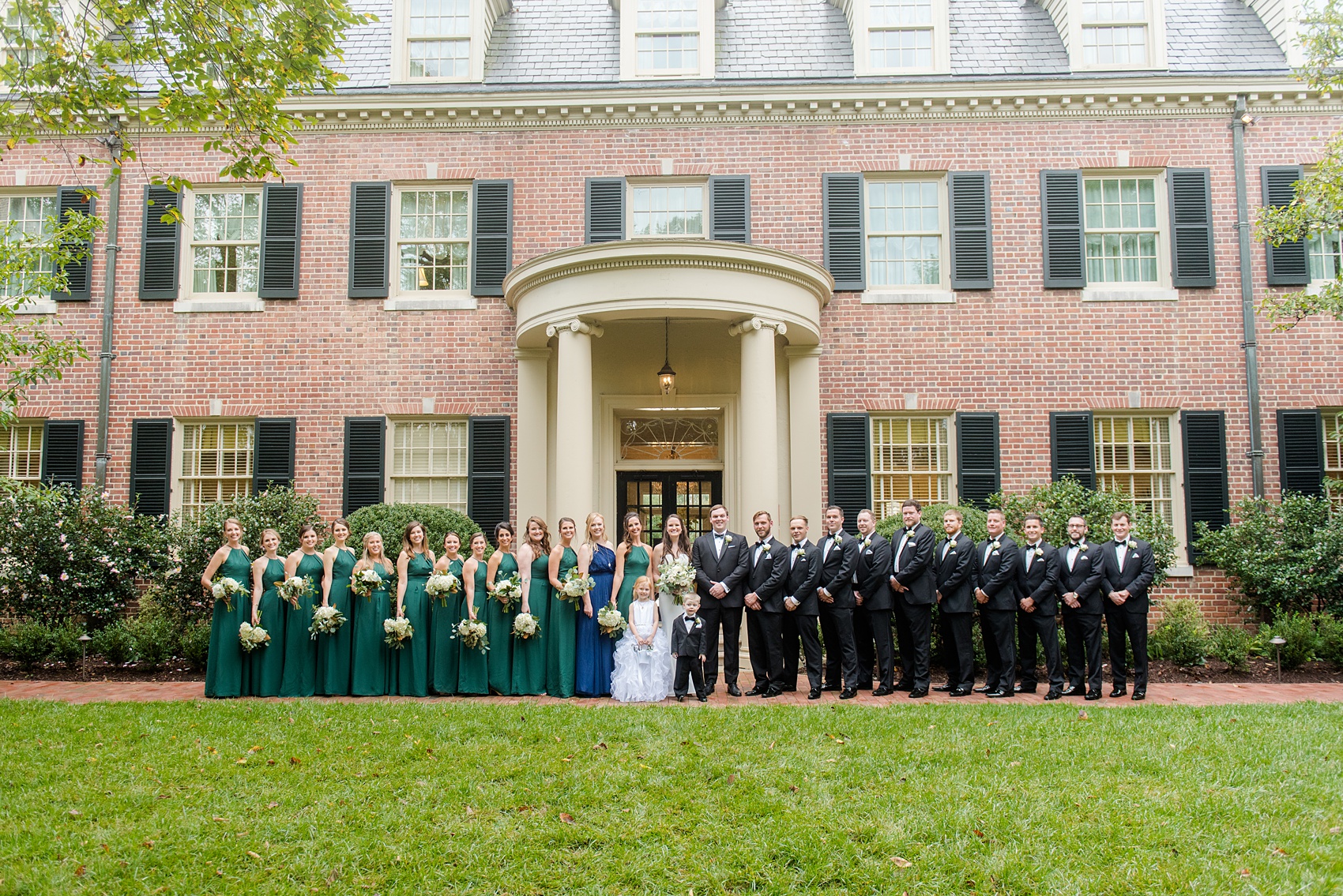 Photos of a fall wedding at The Carolina Inn, in Chapel Hill North Carolina, by Mikkel Paige Photography. This event venue doubles as a hotel for guests, who can enjoy a reception indoors or outdoors. The bridesmaids wore long green gowns and carried white bouquets with eucalyptus greenery.Click through to see inspiration from the entire wedding! Planner: @asouthernsoiree, Flowers by The Flower Cupboard #thecarolinainn #ChapelHillWeddings #MikkelPaige #greenbridesmaids #bridalparty #weddingparty