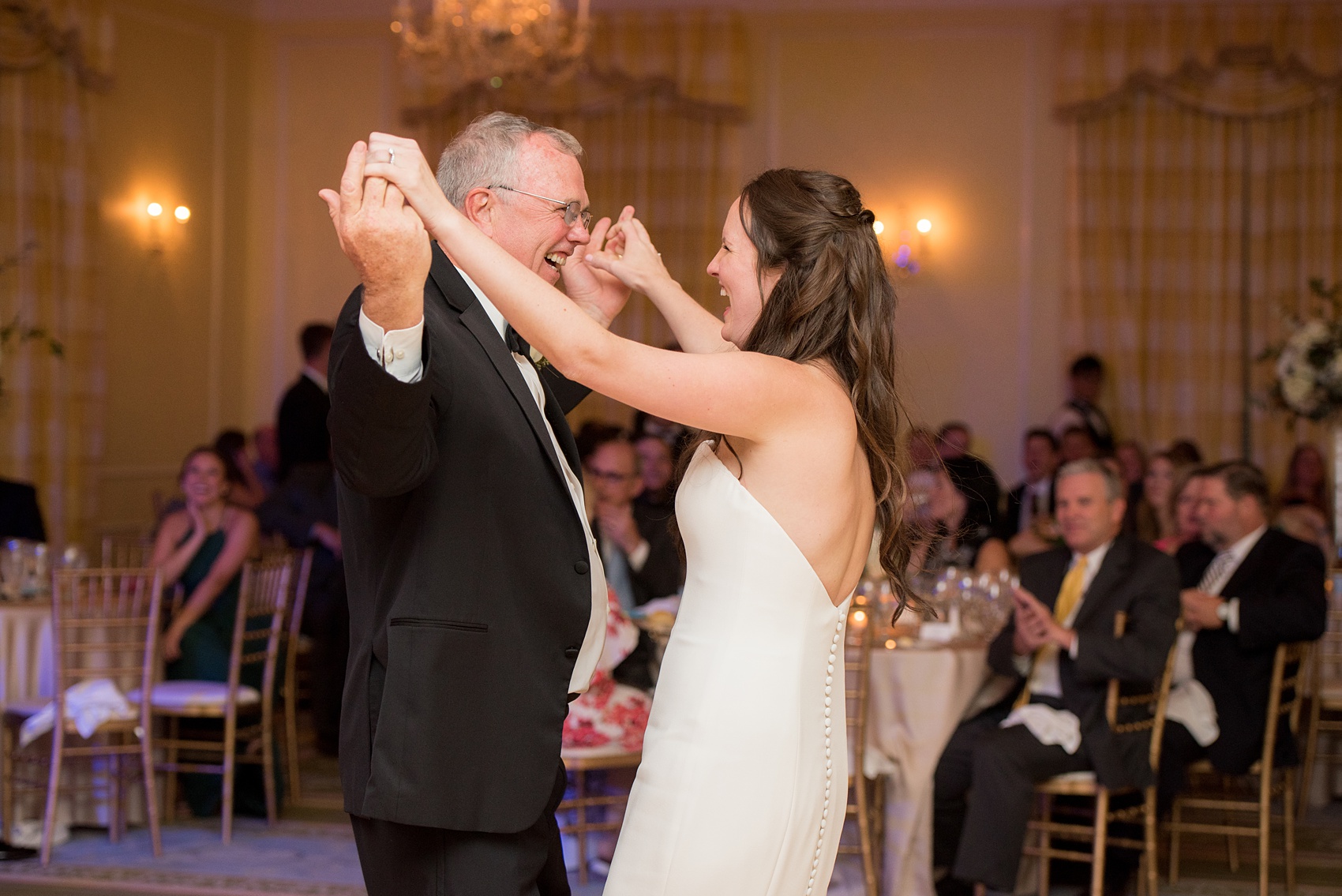 Photos of a fall wedding at The Carolina Inn, in Chapel Hill North Carolina, by Mikkel Paige Photography. This event venue doubles as a hotel for guests, with a for an indoor reception space. The bride and groom danced their first dance, listened to toasts and speeches and cut their cake in a beautiful ballroom. Click through to see all of this wedding inspiration! Planning by @asouthernsoiree #thecarolinainn #ChapelHillWeddings #MikkelPaige #ballroom #fatherofthebride