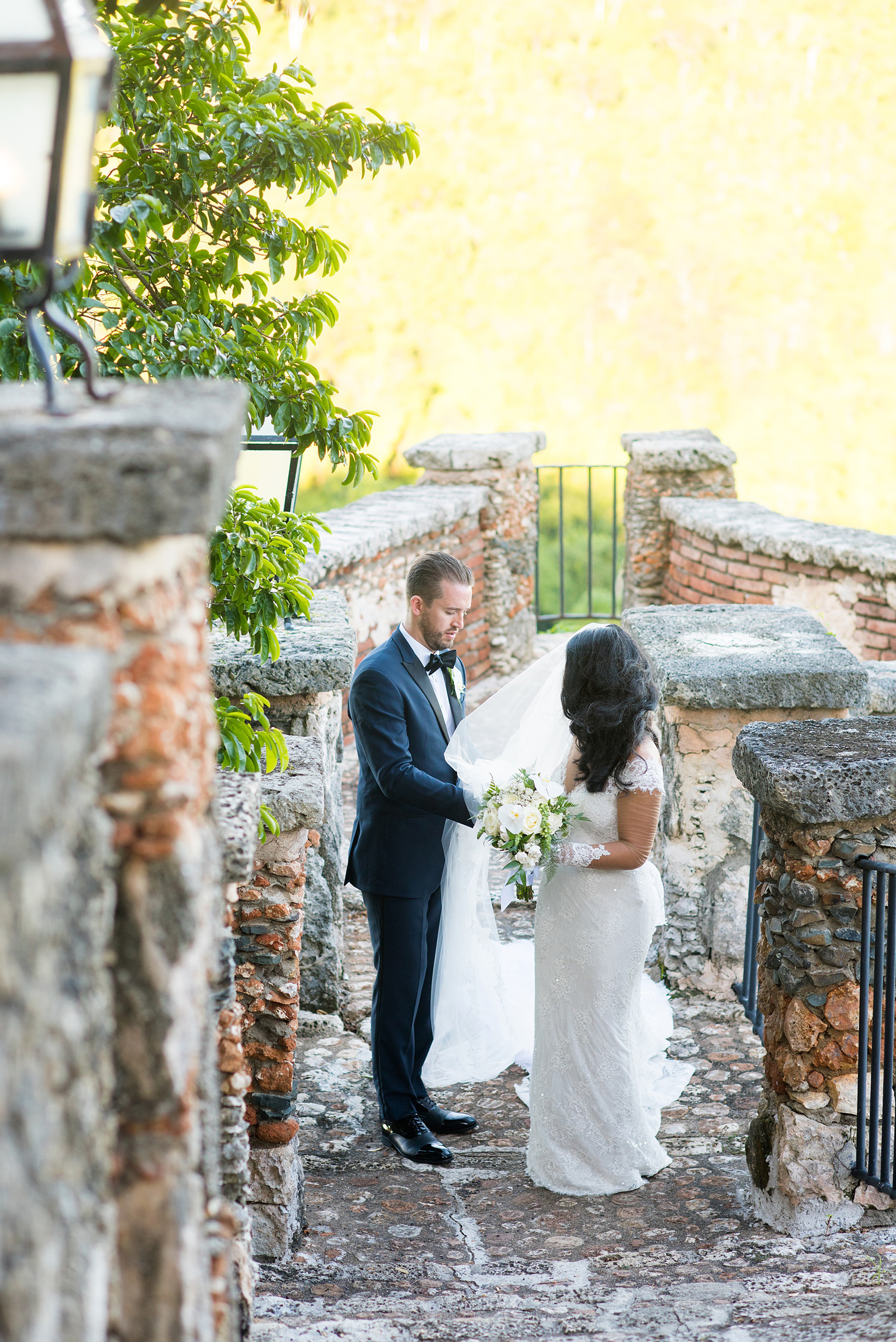 Planning a destination wedding? La Romana is 1 hour from Punta Cana and home to an incredible, all inclusive resort with a beautiful beach and mountains view in the Dominican Republic. It’s a great location, which these pictures of the bride and groom by Mikkel Paige Photography prove again and again! It also doubles as a vacation and honeymoon spot. Click through for more Casa de Campo wedding photography and ideas! Coordination by @theeventeur #mikkelpaige #brideandgroom #destinationwedding