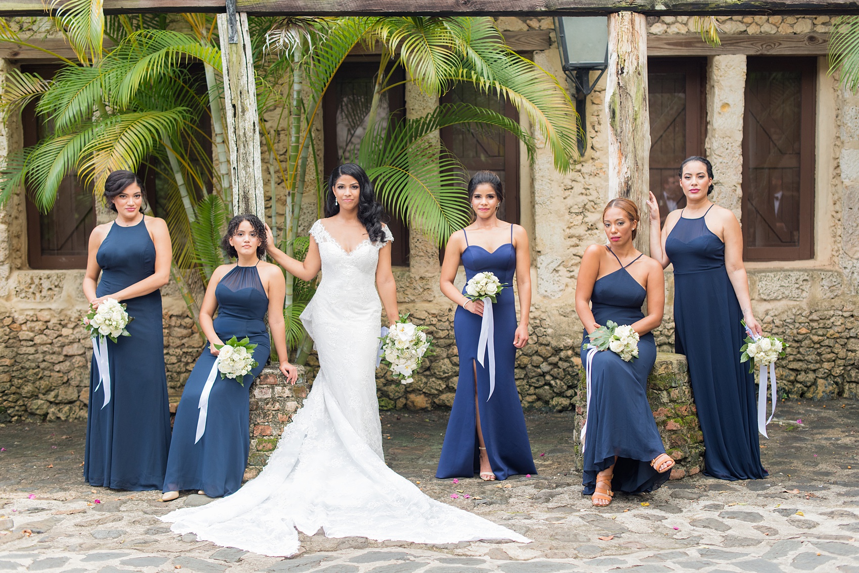 Mikkel Paige Photography, destination wedding photographer, pictures from Casa de Campo. This incredible venue in the Caribbean is in La Romana, Dominican Republic. It has such character and awesome, beautiful locations for photography at every turn. This photo of the bridesmaids in navy gowns was very Vogue-like and its creativity will give you great ideas for your day. Click through for more! #DestinationWedding #DestinationWeddingPhotographer #MikkelPaige #DominicanRepublicWedding 